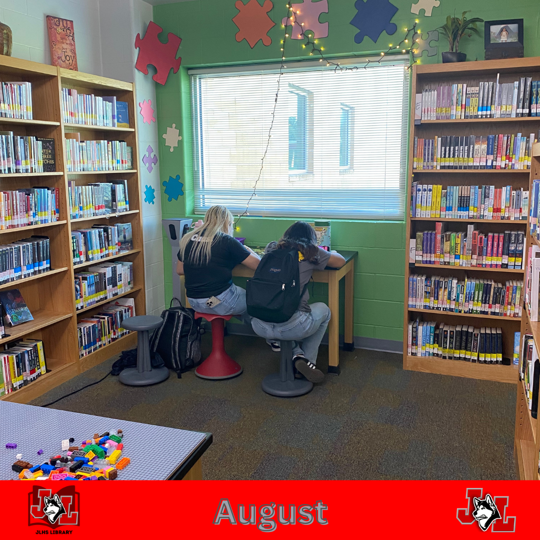 students working on puzzle in library