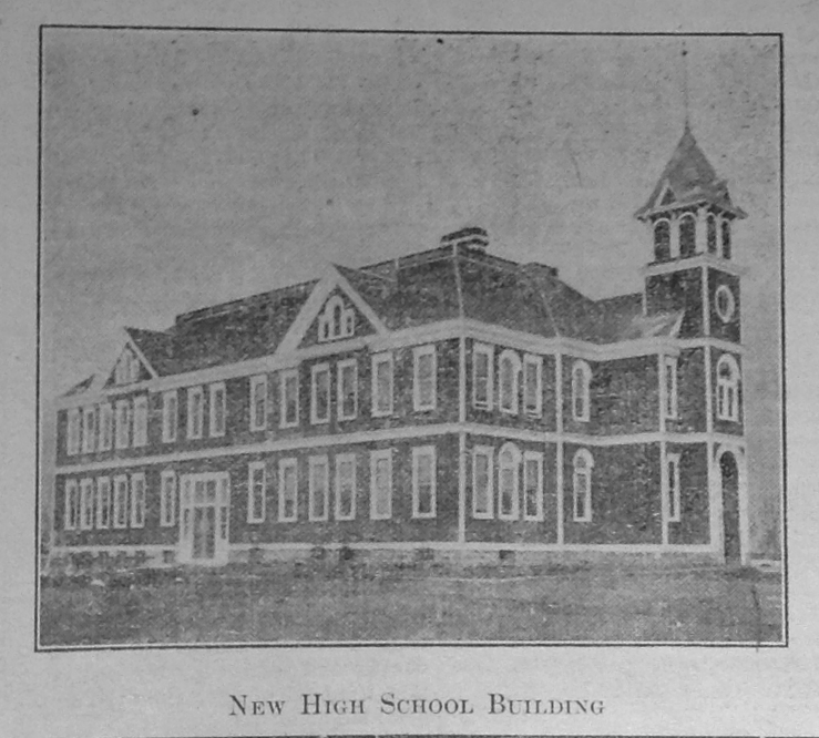 black and white photo of the building labeled new high school building