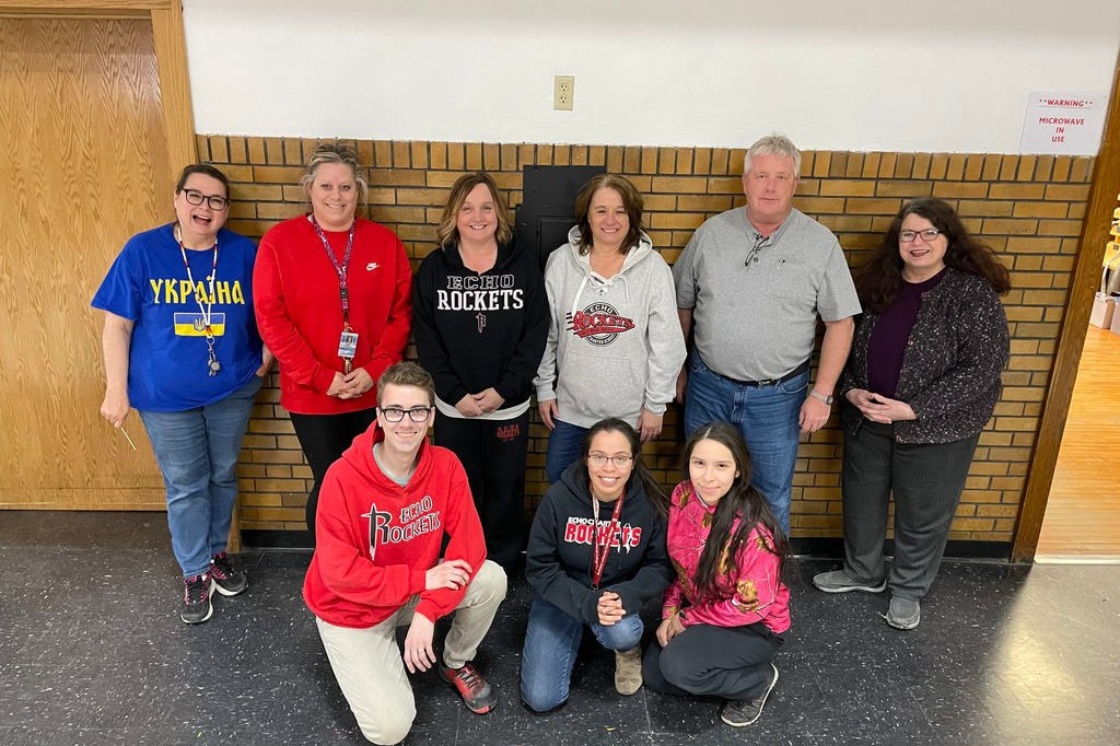 students smile with teachers