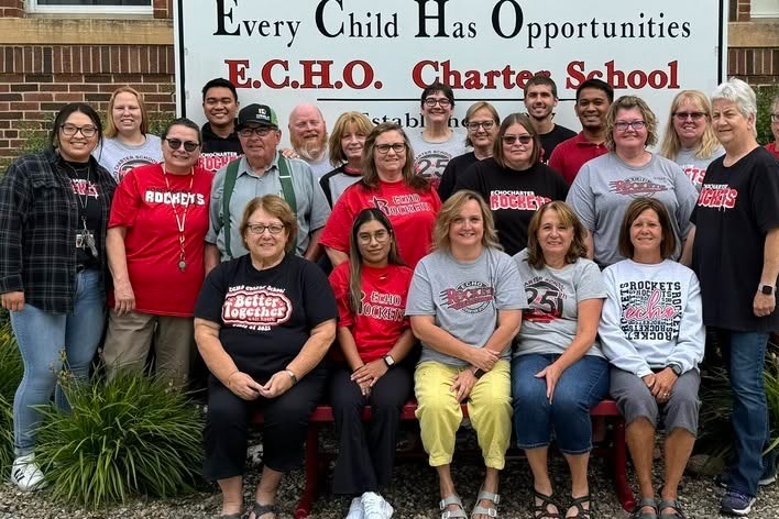 students smile with teachers