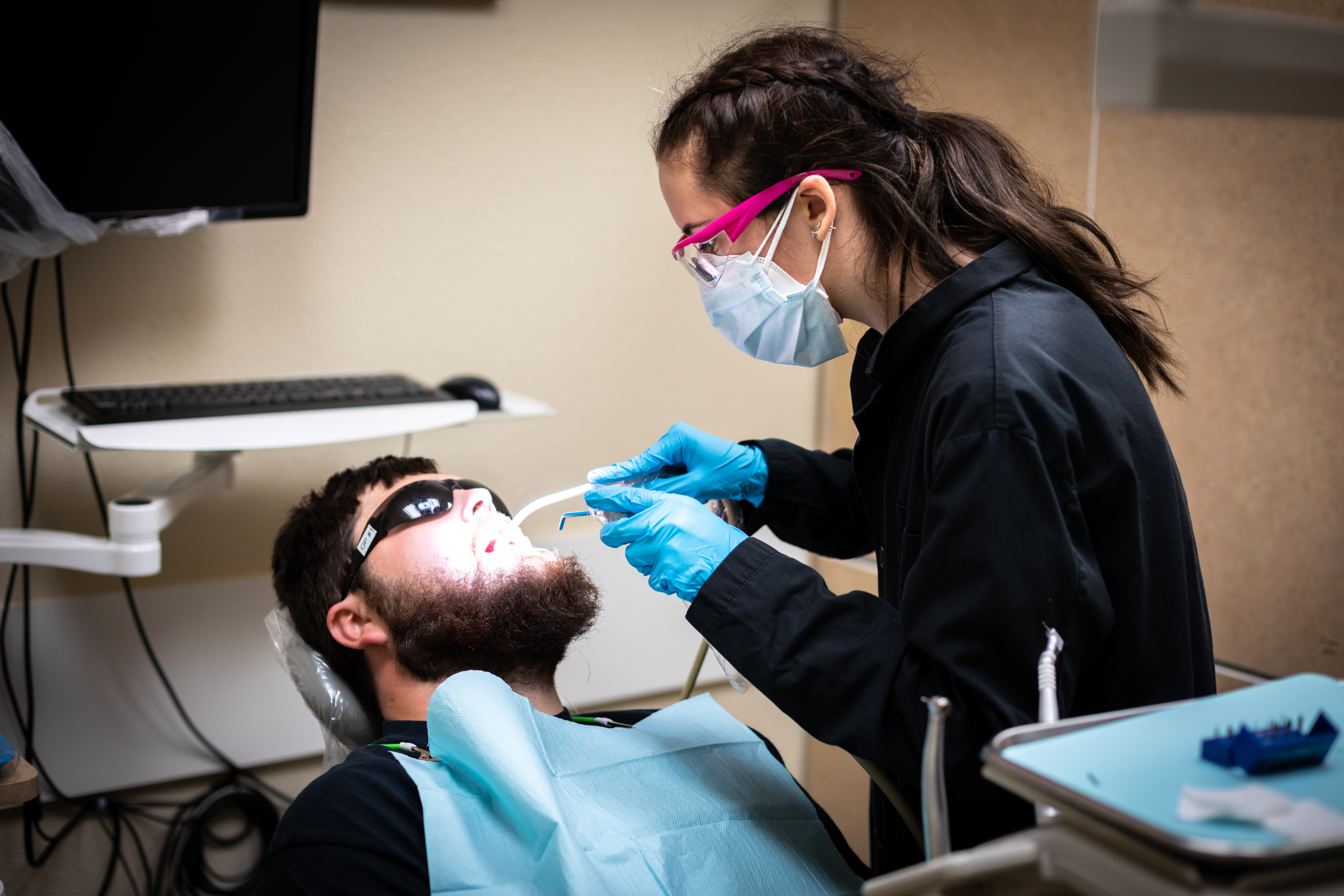 Student working on a patient