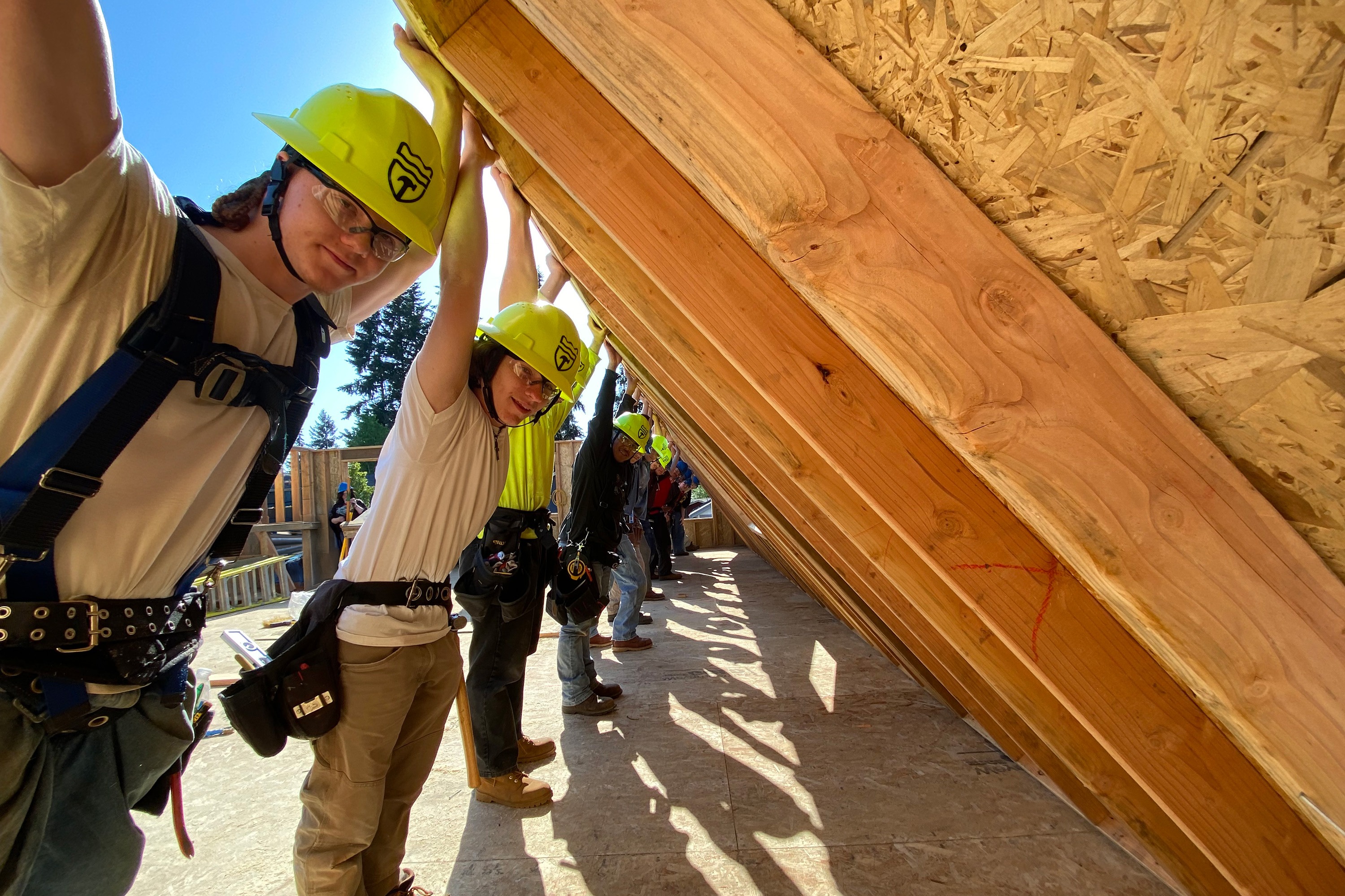 Up close of students looking at building plans