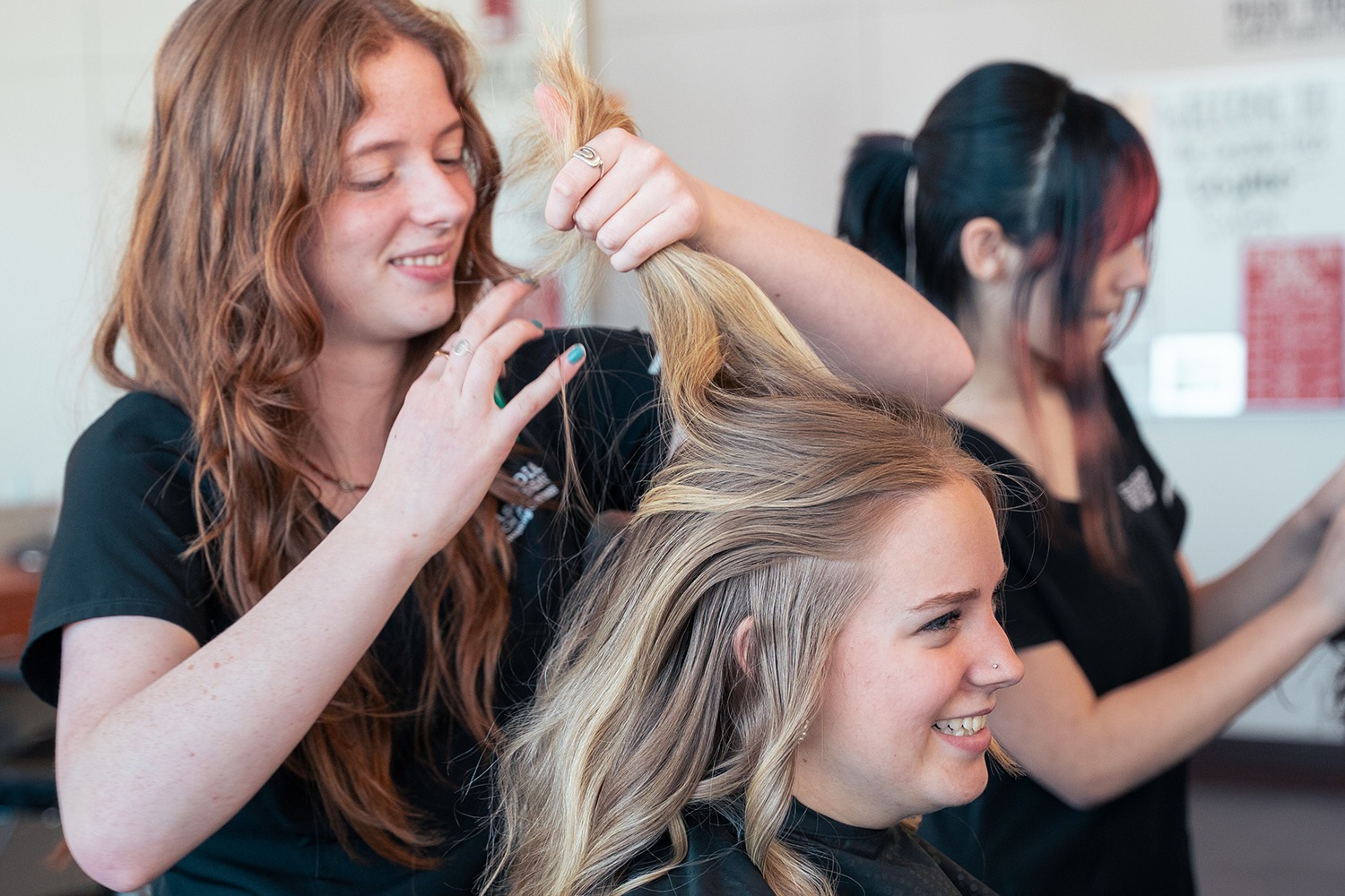 STUDENT USING A CURLING IRON