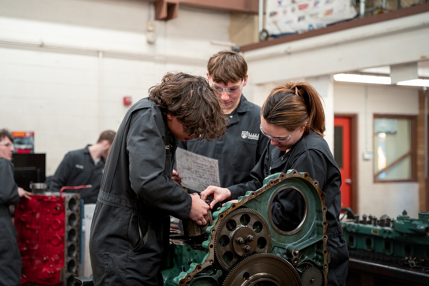2 STUDENTS WORKING ON A SEMI
