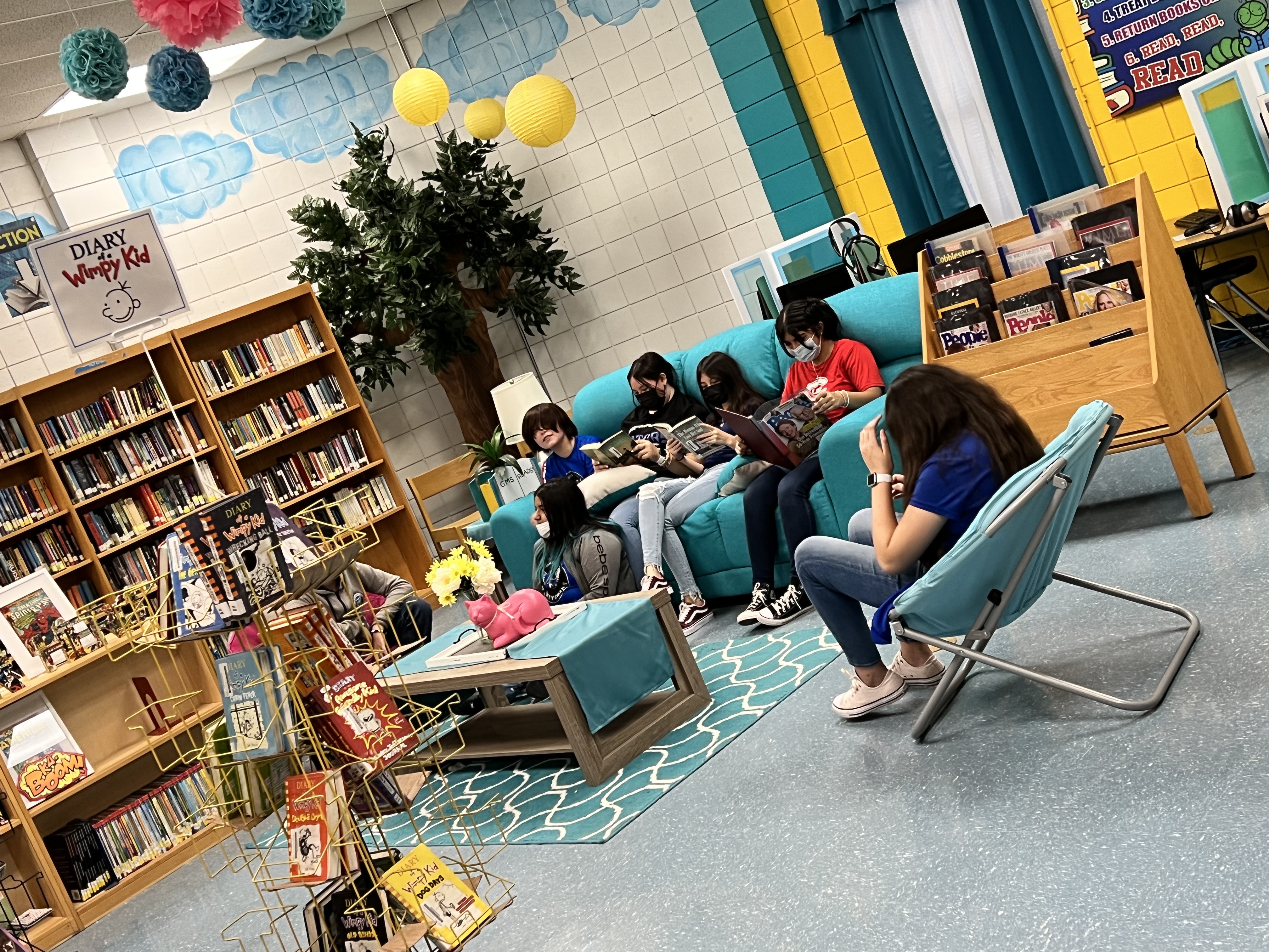 Students enjoying reading in sofas