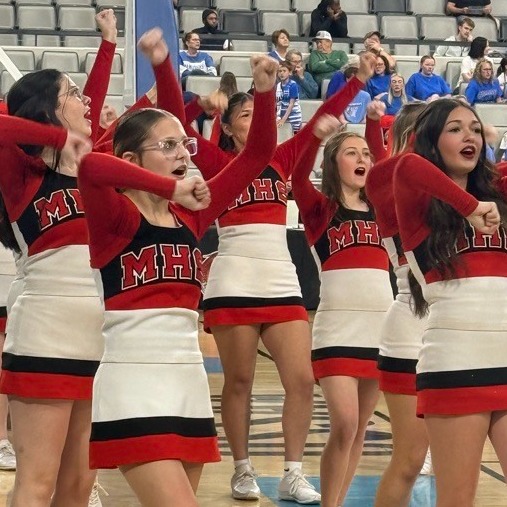 cheerleaders cheering at basketball game