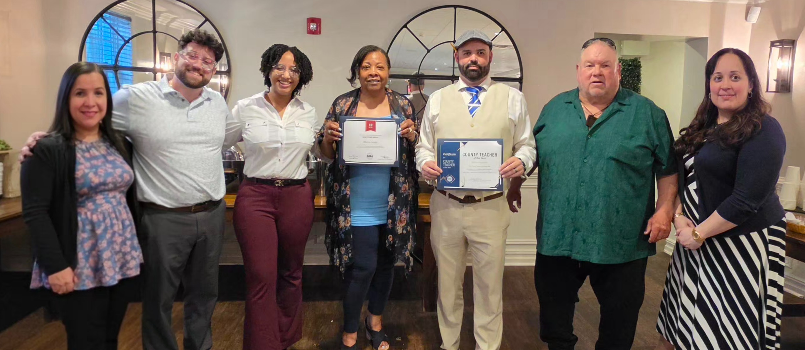 Penns Grove-Carneys Point board members and the district office administration with the awardees, Ms. Smith and Mr. Fitzpatrick.