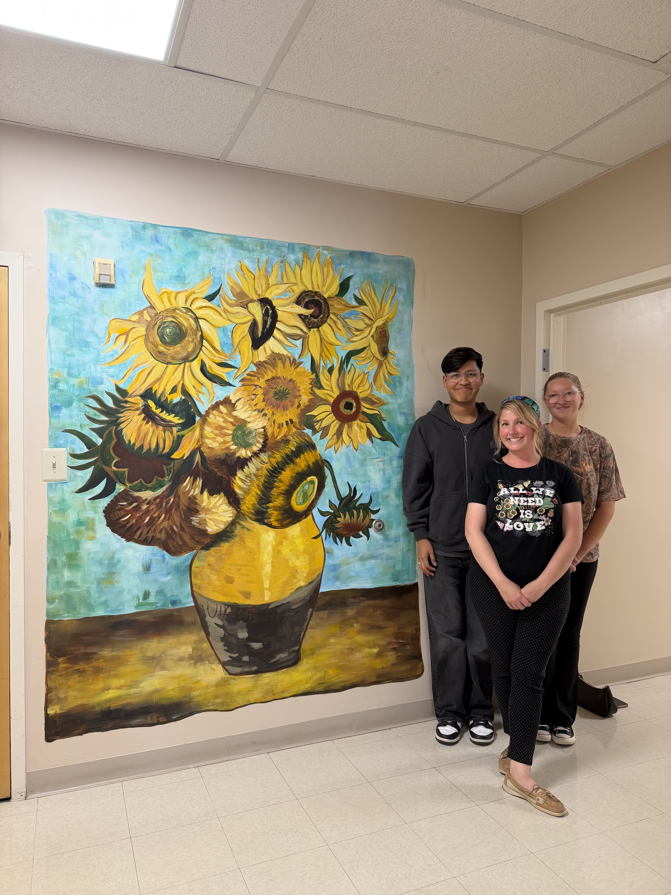 Mrs. Jones and Students in front of their mural.