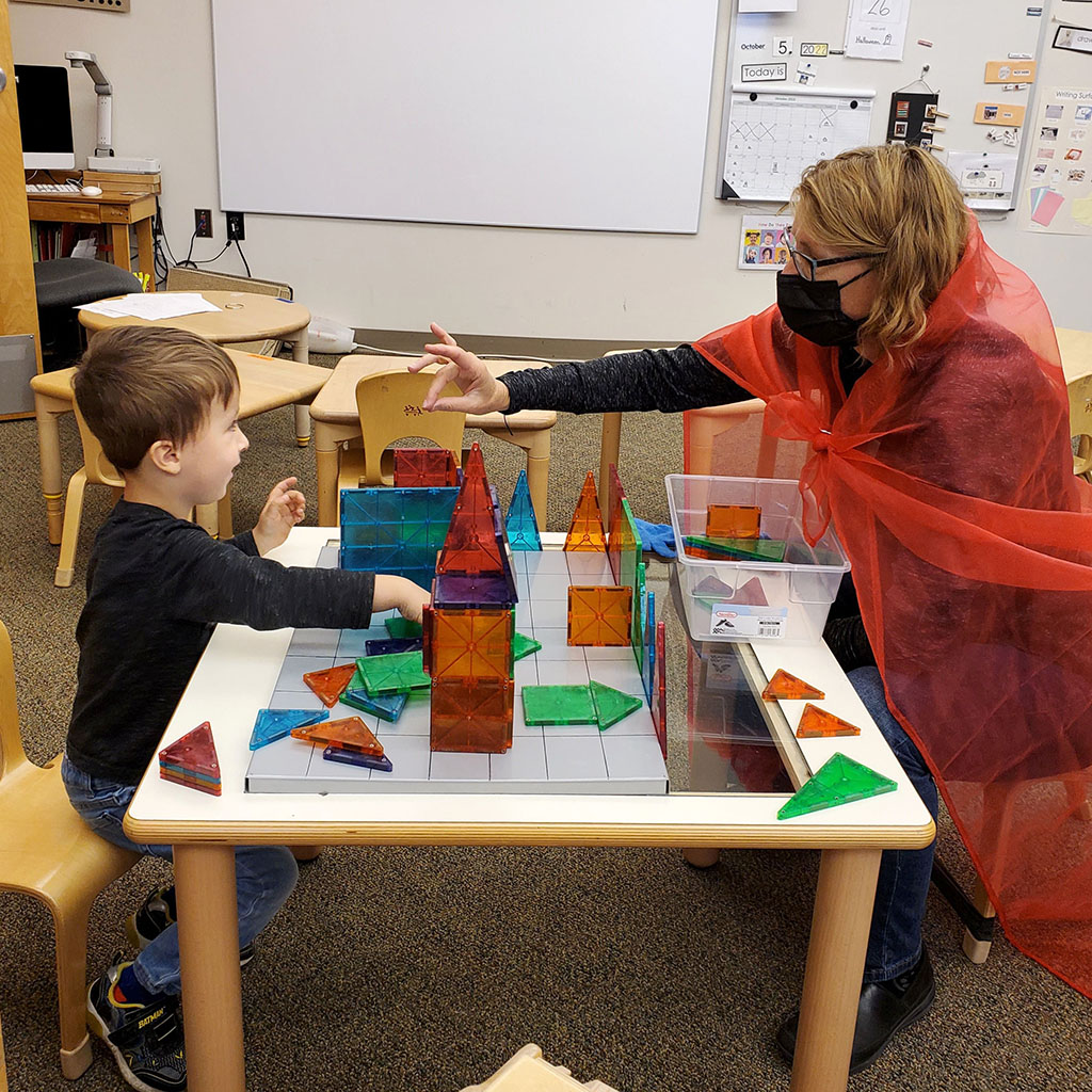 Teacher and ECE student working with colorful shapes