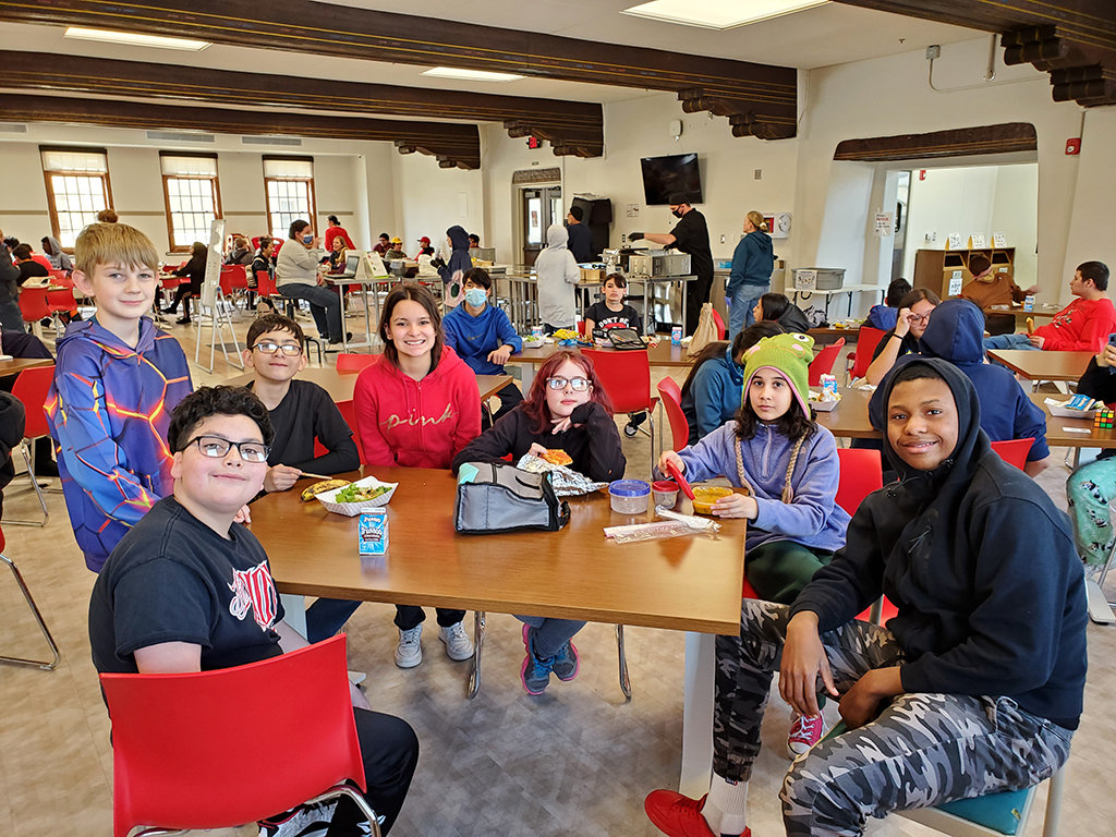 Middle School students eating in the dining hall