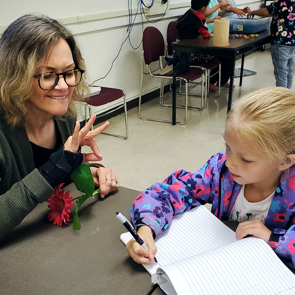 Educational Consultant with student in public school classroom