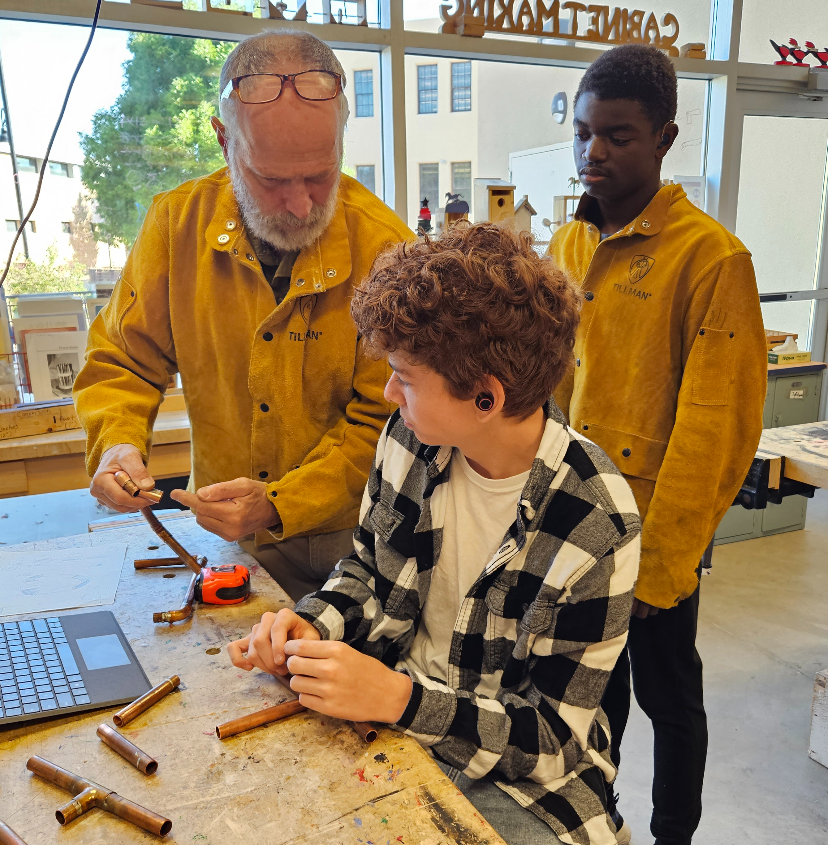 Teacher and student in shop class