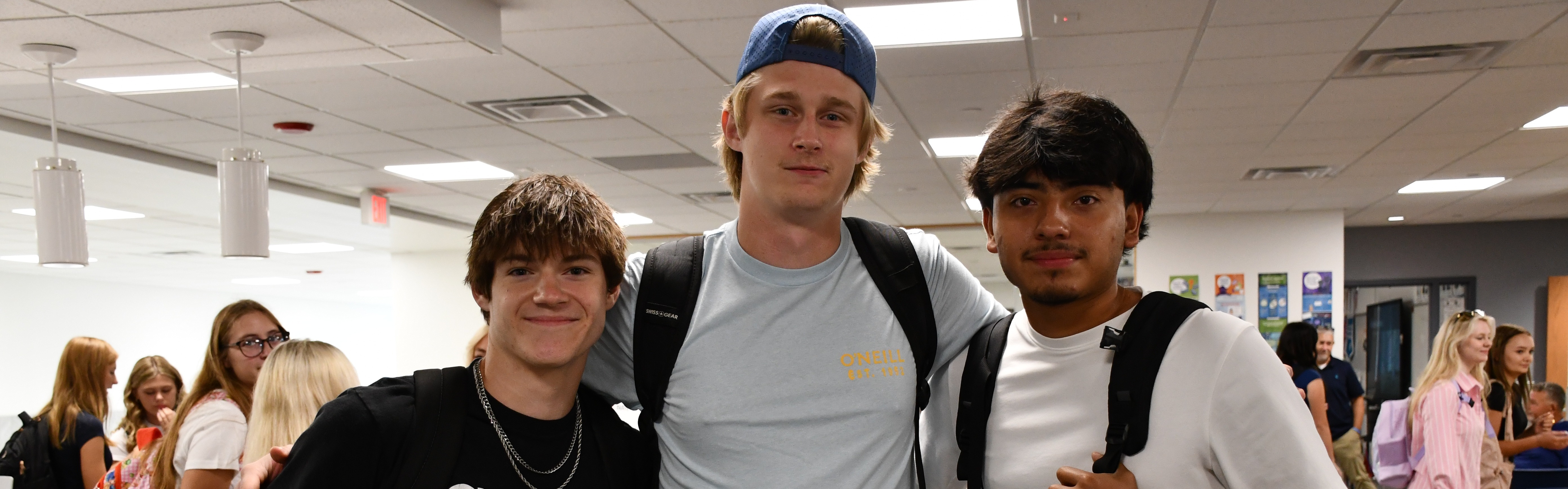 three boys in the hallway