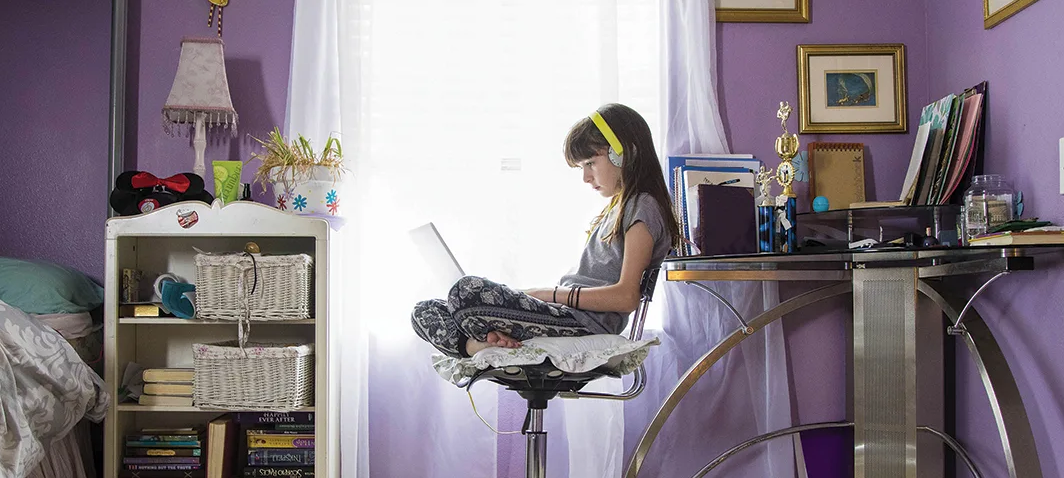 student on computer at home