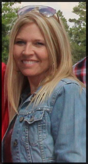 Smiling woman wearing a blue denim top