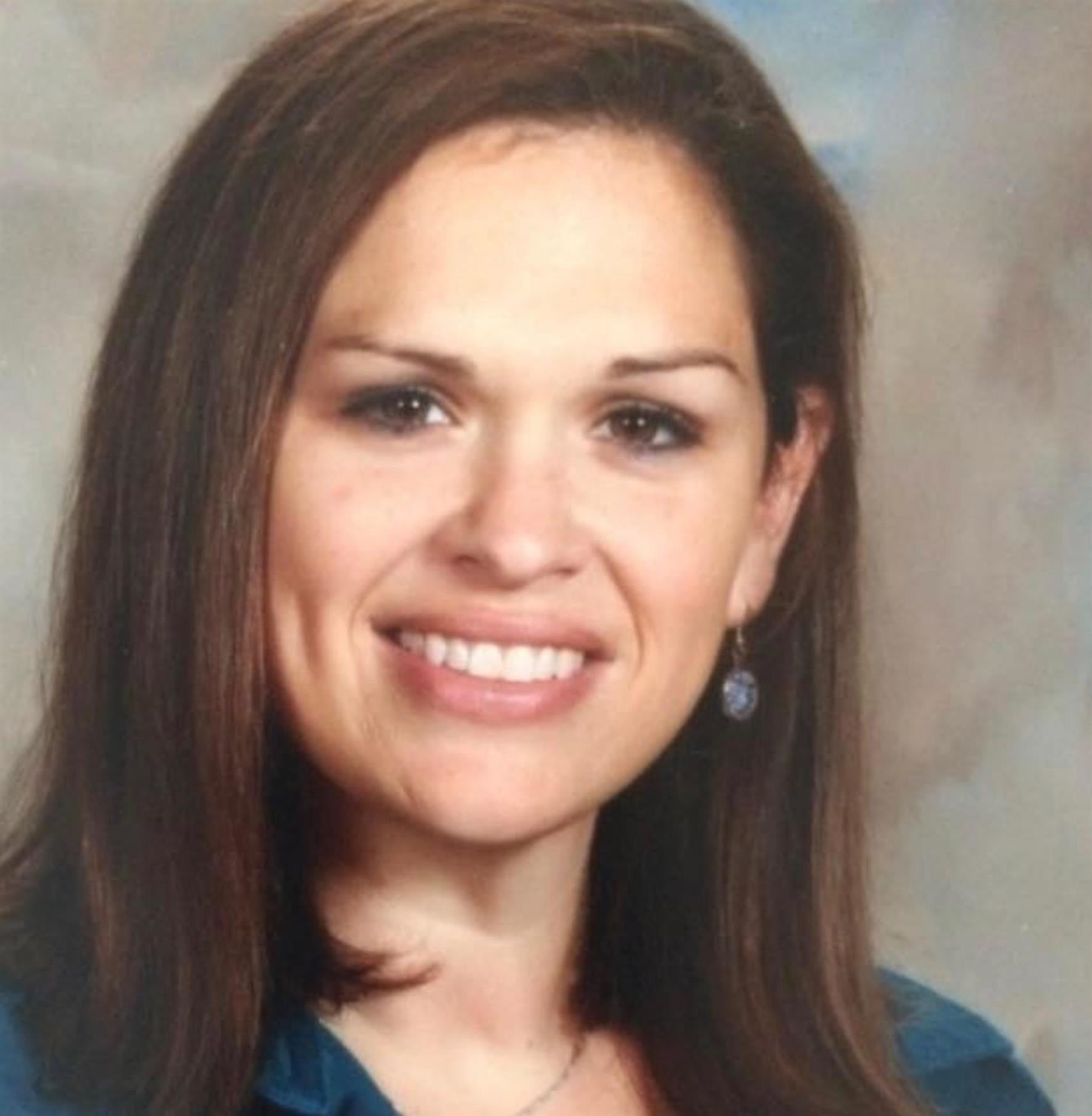 Smiling woman wearing blue blouse