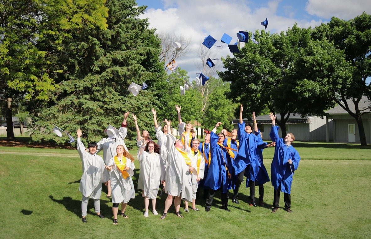 graduation caps being thrown