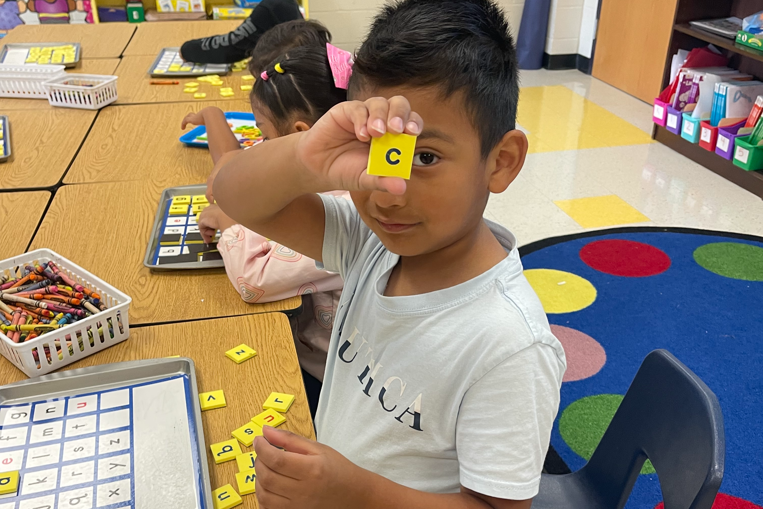 Kindergarten ESL students learning letters