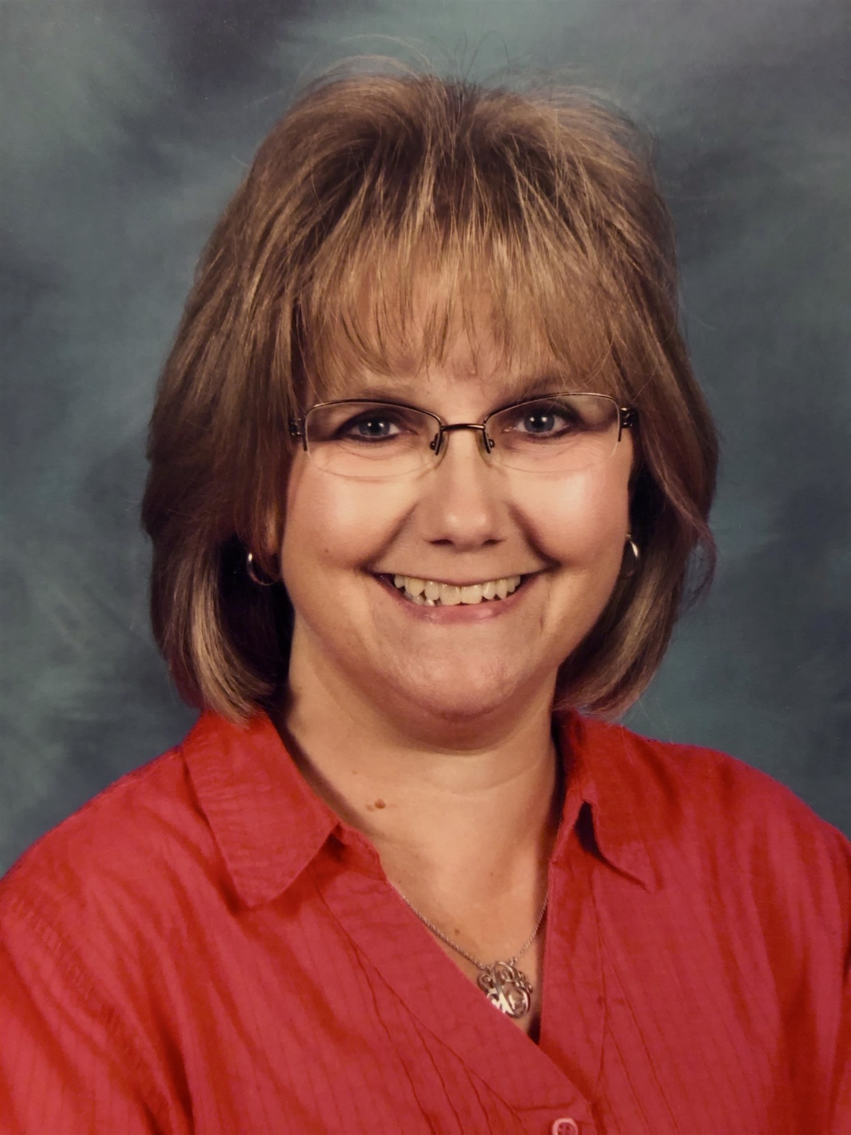Smiling woman wearing red blouse