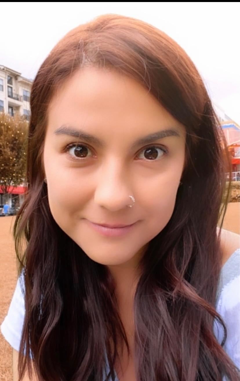 Woman looking into camera wearing a nosering