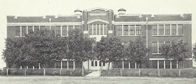 An old picture of the front of the school