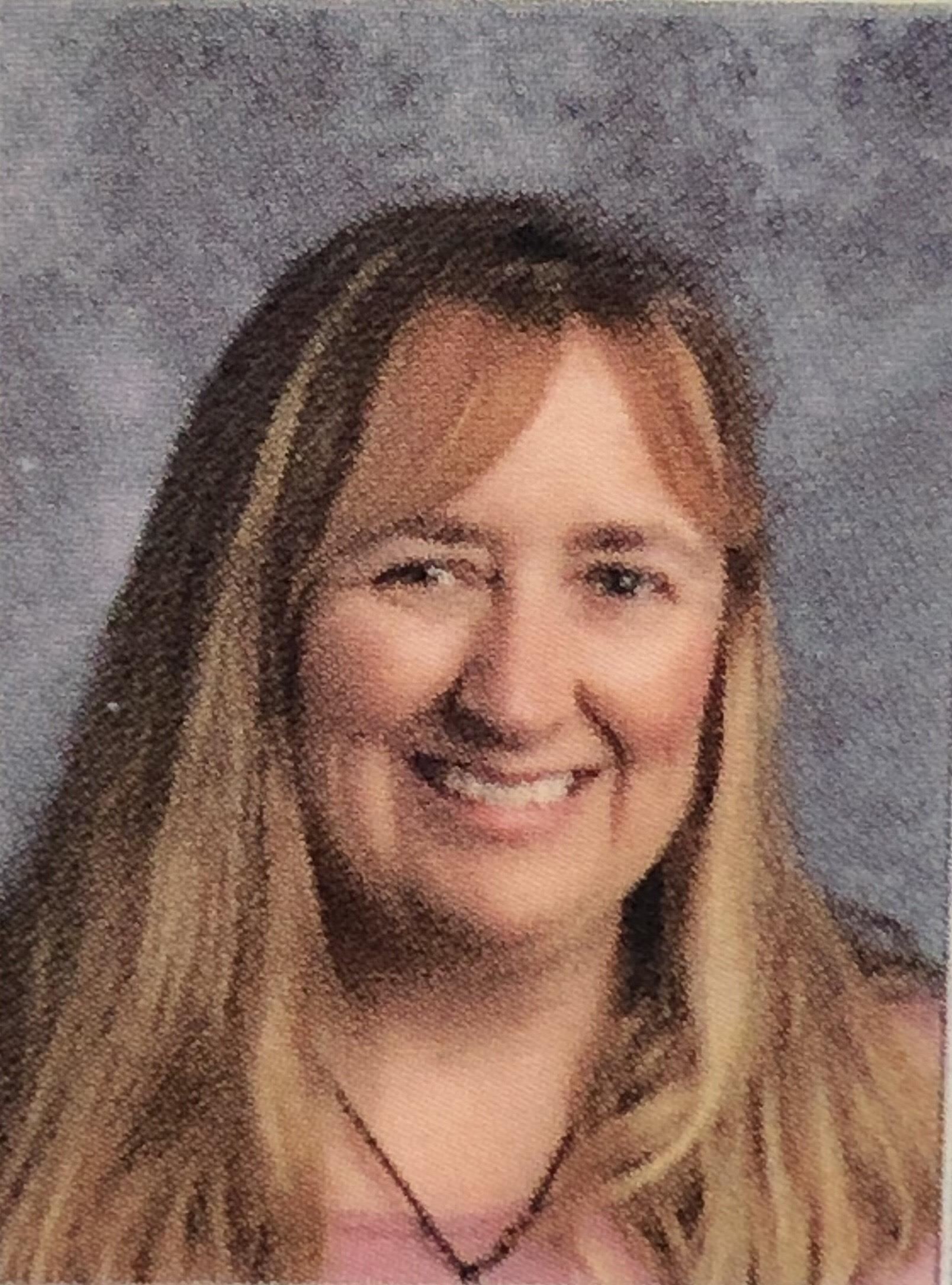 headshot of Mrs. Jennifer Howard smiling with long hair