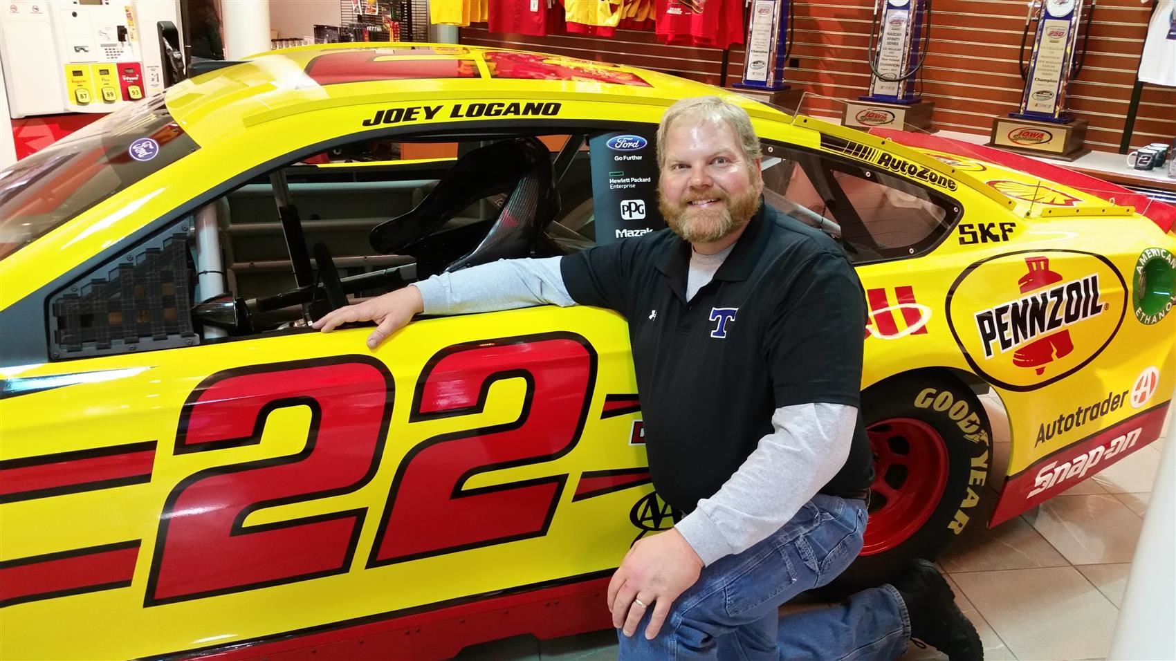 Harold O. Strickland Jr with a nascar car