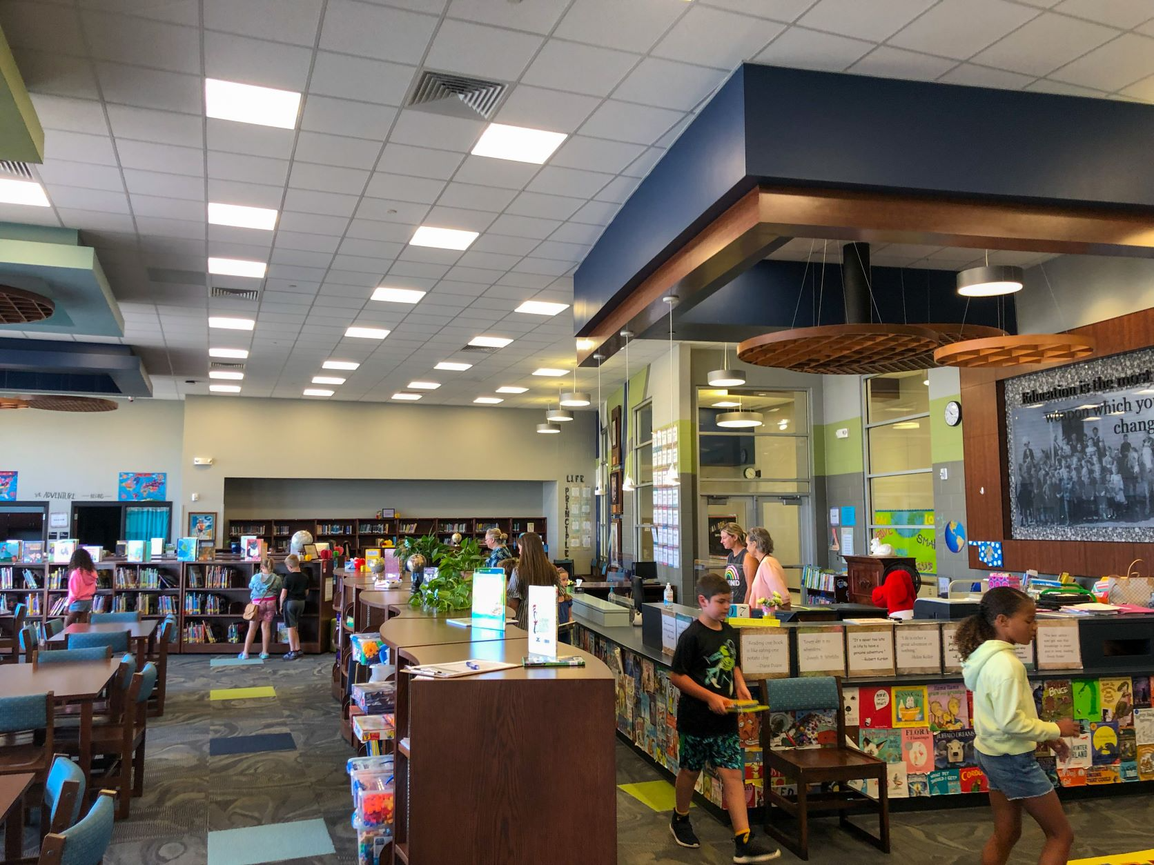 Students with books in library  