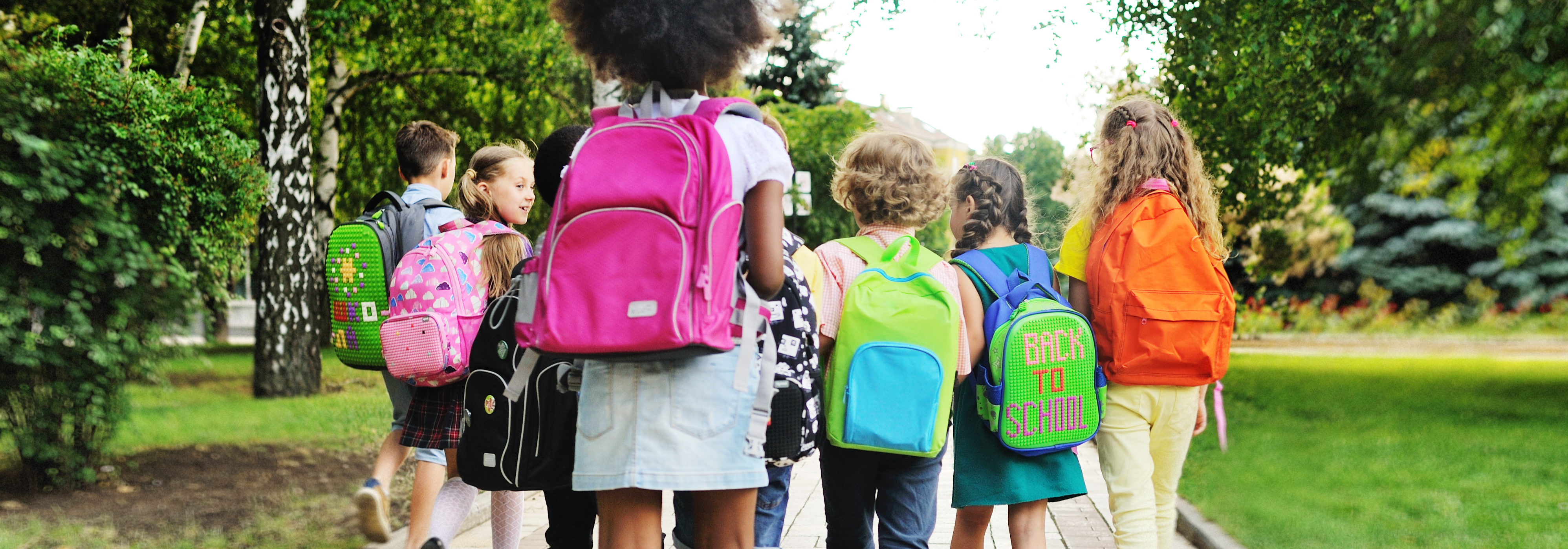 elementary students with backpacks