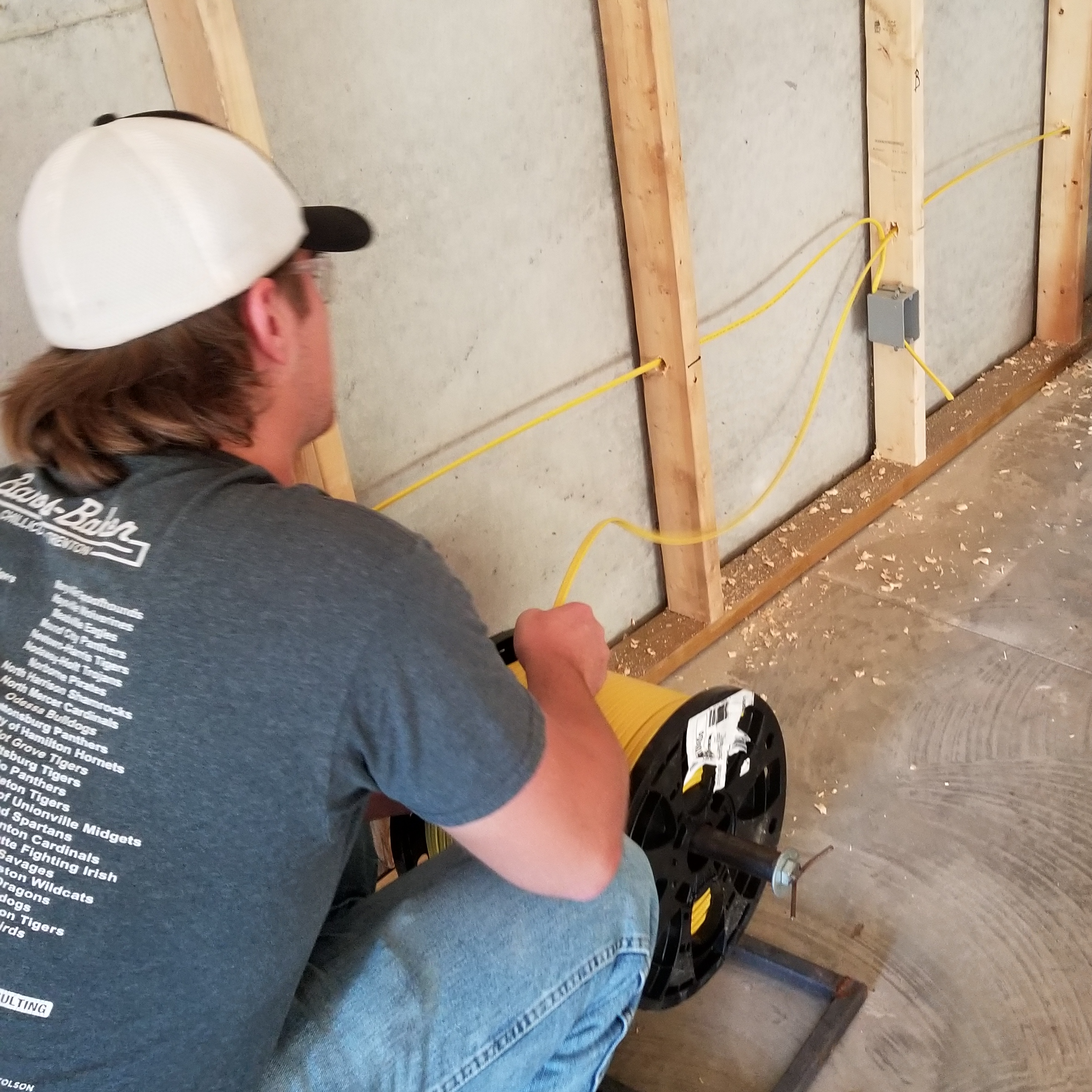 student works on wiring a home