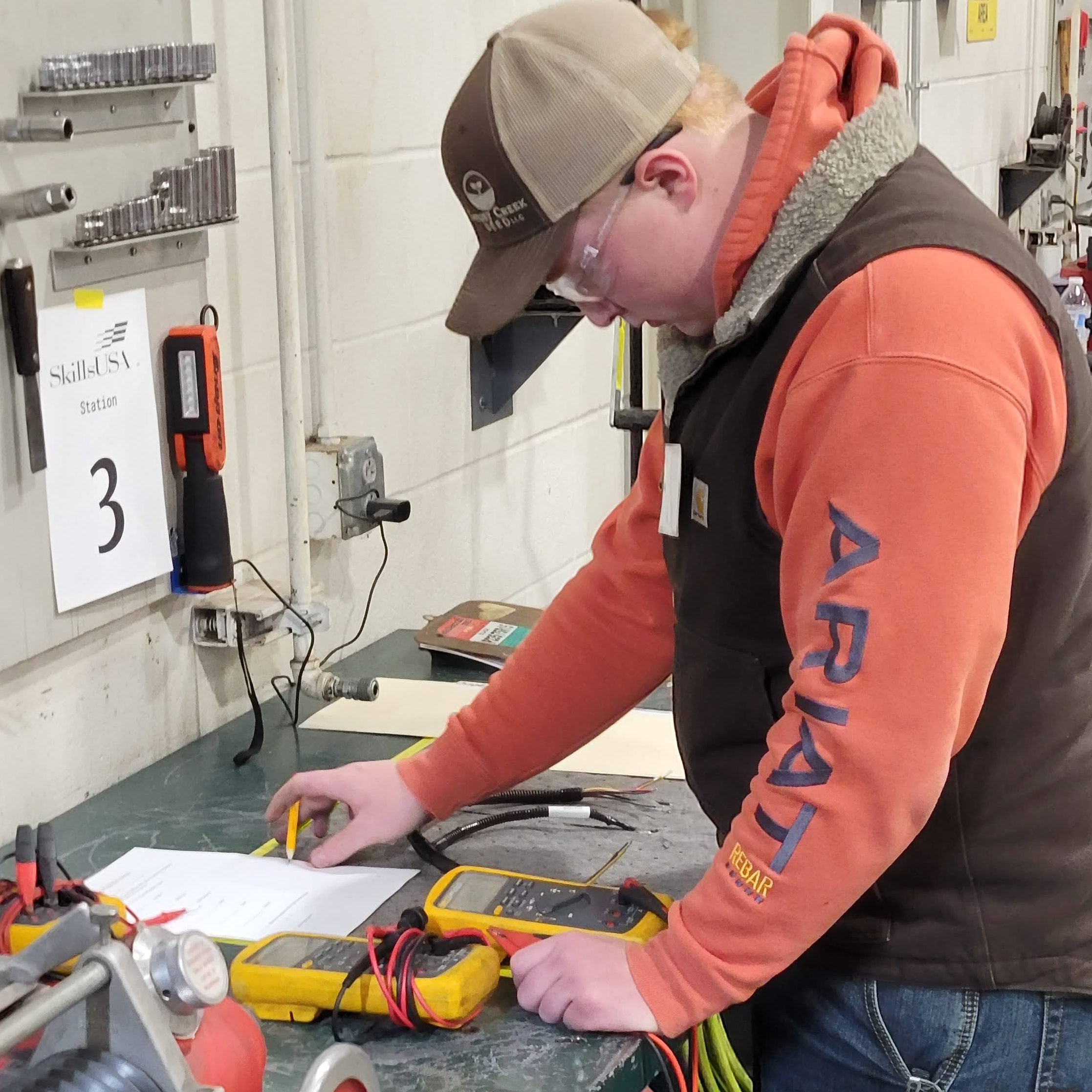 student working on electrical test