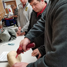 EMS students learn to take a patients vitals