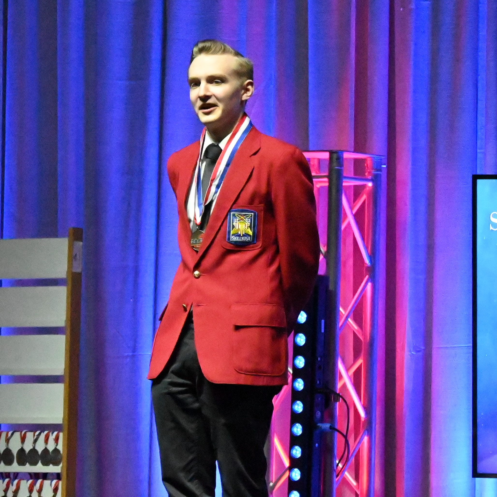 SkillsUSA member receiving award at State competition and being selected to move on to National competition