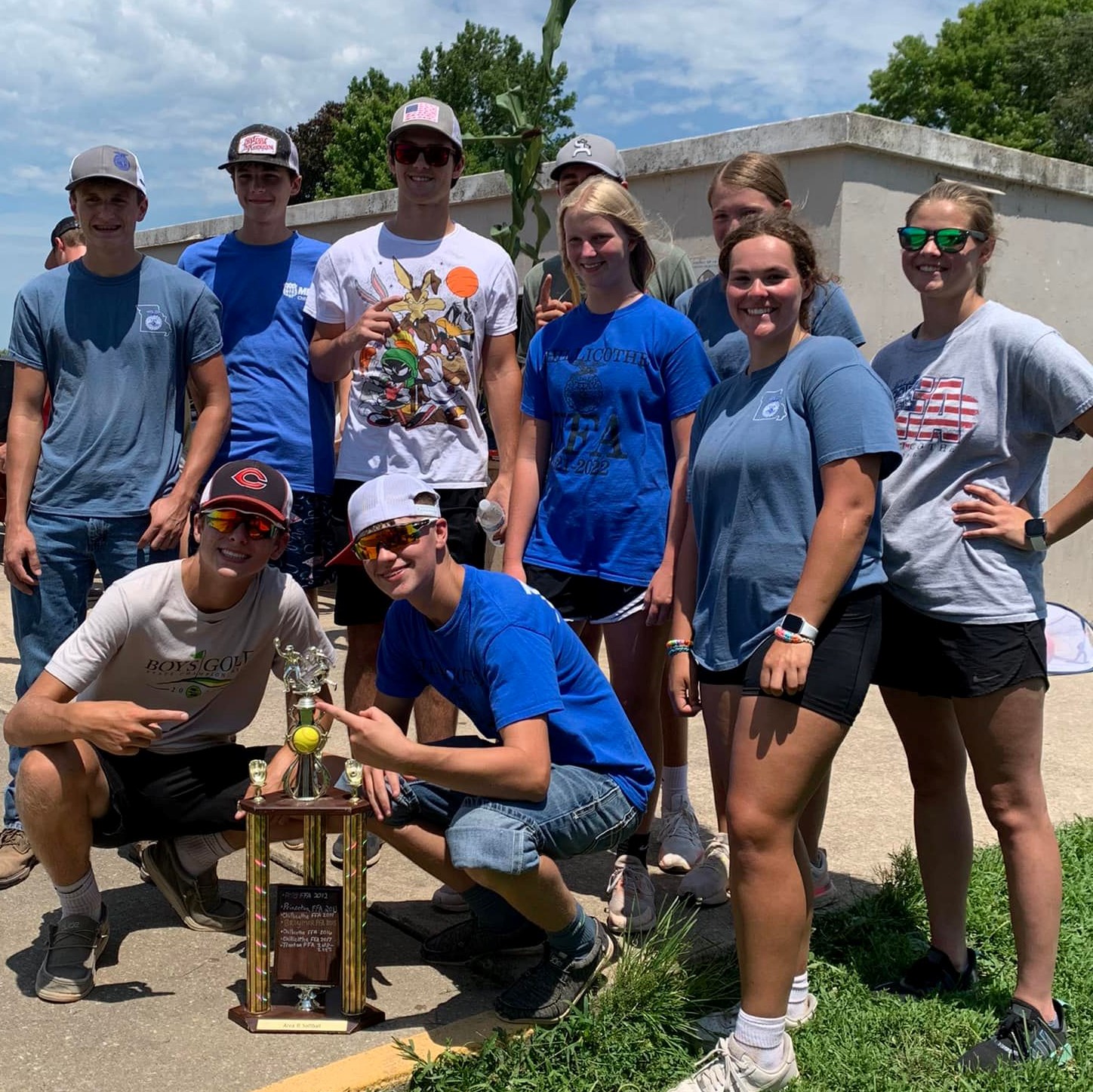 ffa members pose with trophy they won at area two sports day