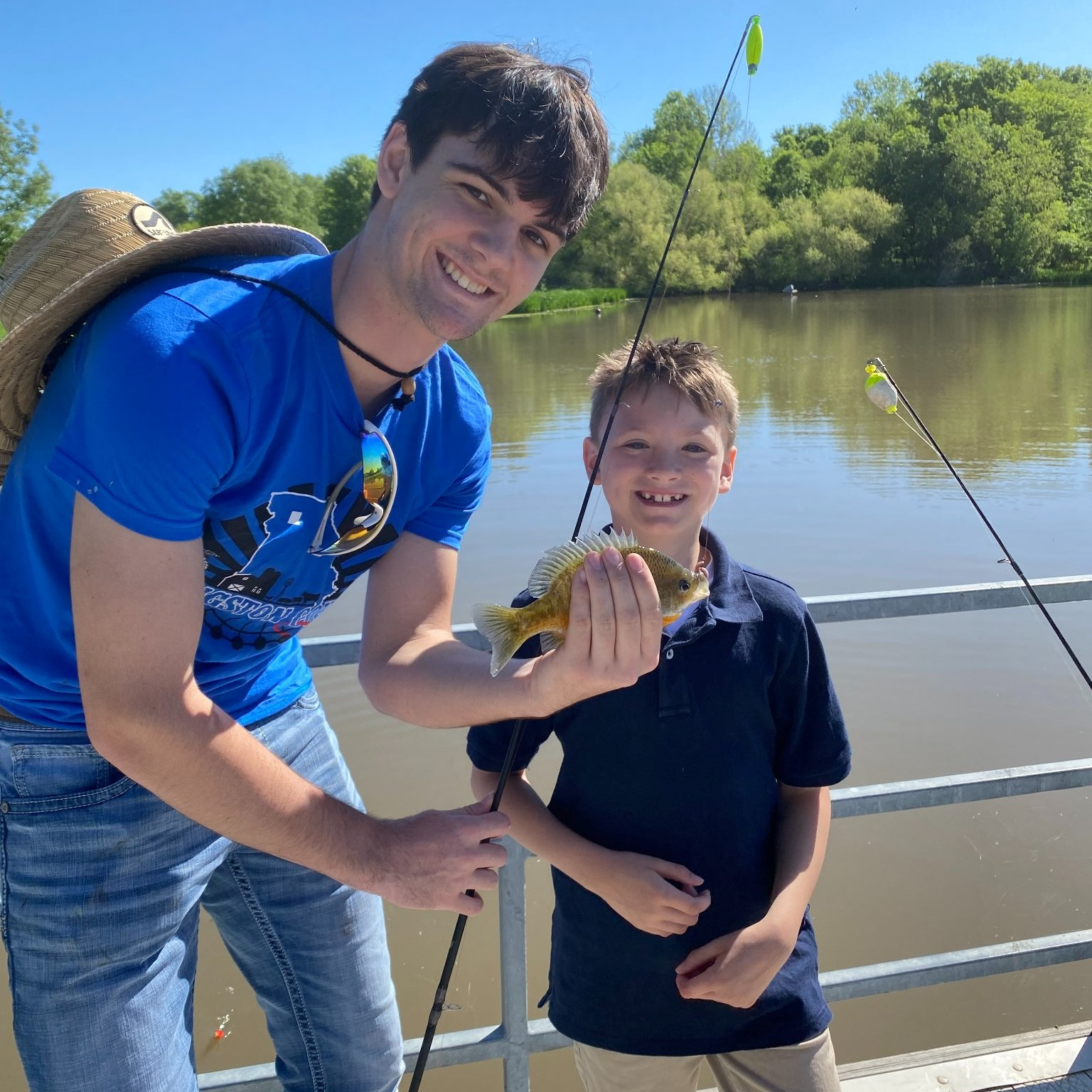 ffa member shows off fish caught by a litton crusader student