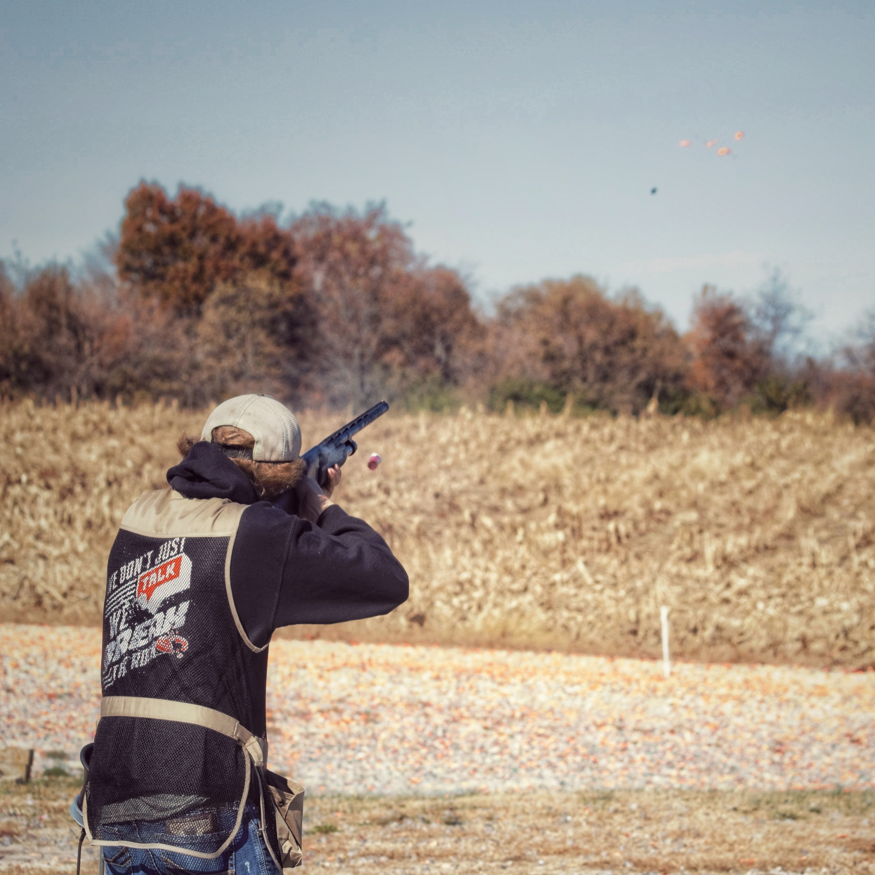 ffa trap team member shoots a clay target