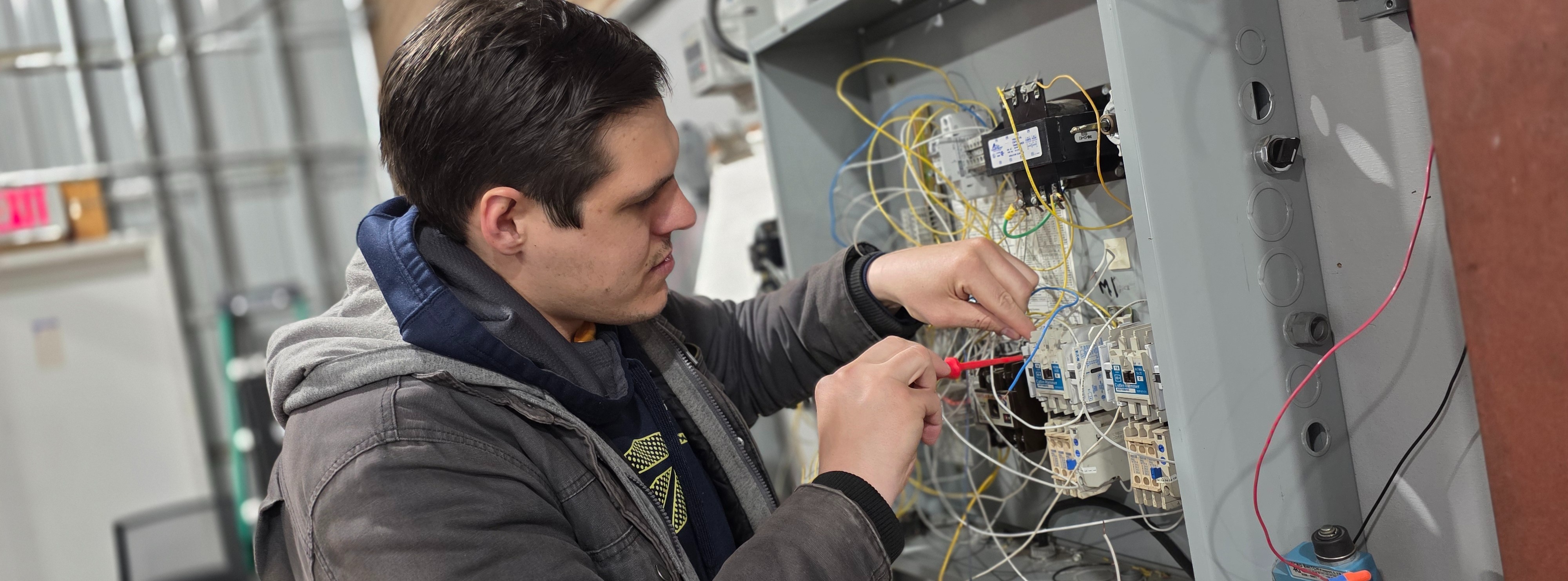Automation and Electrical Technology student working on electrical grid board