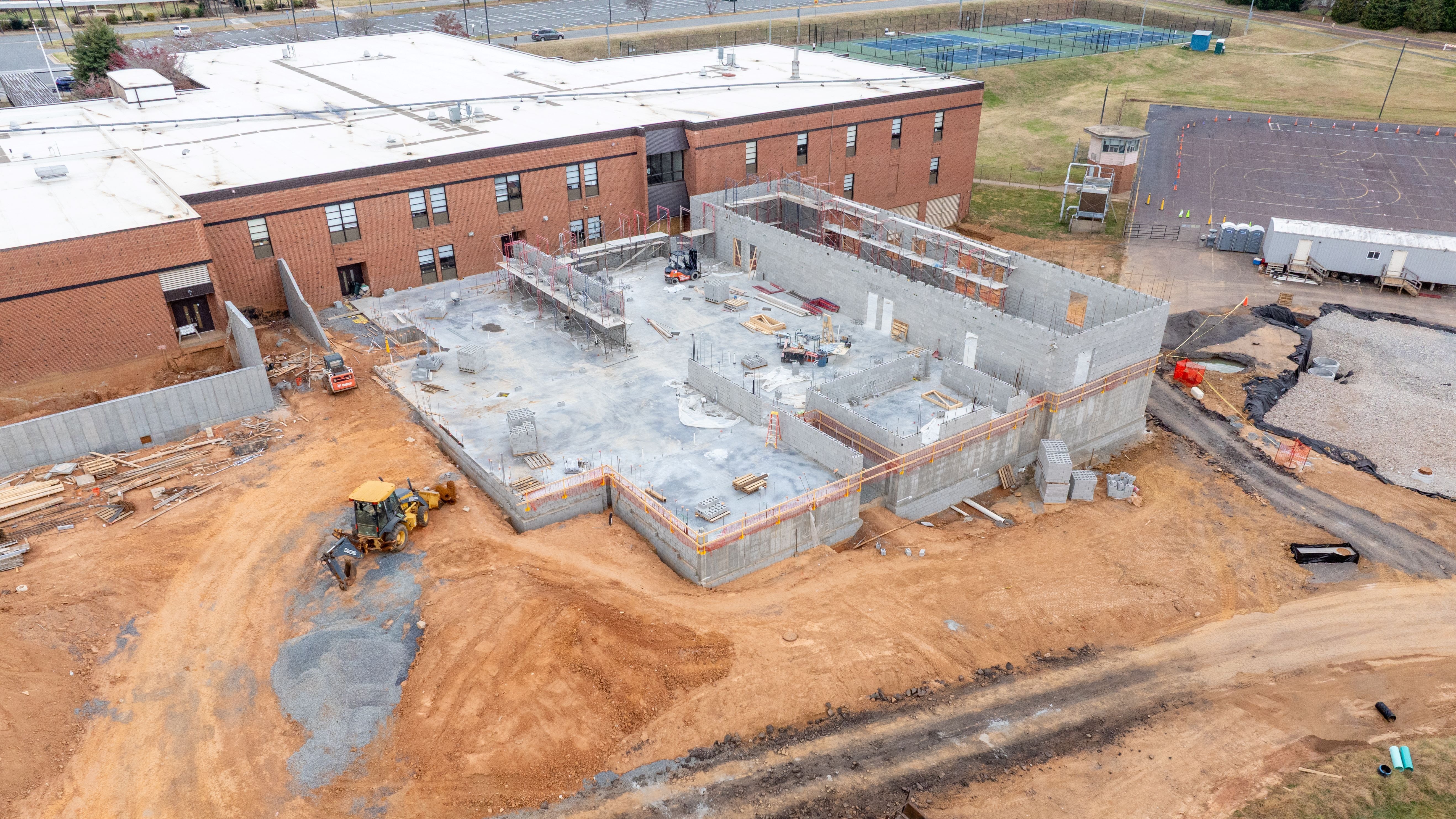 construction site showing dirt and block walls