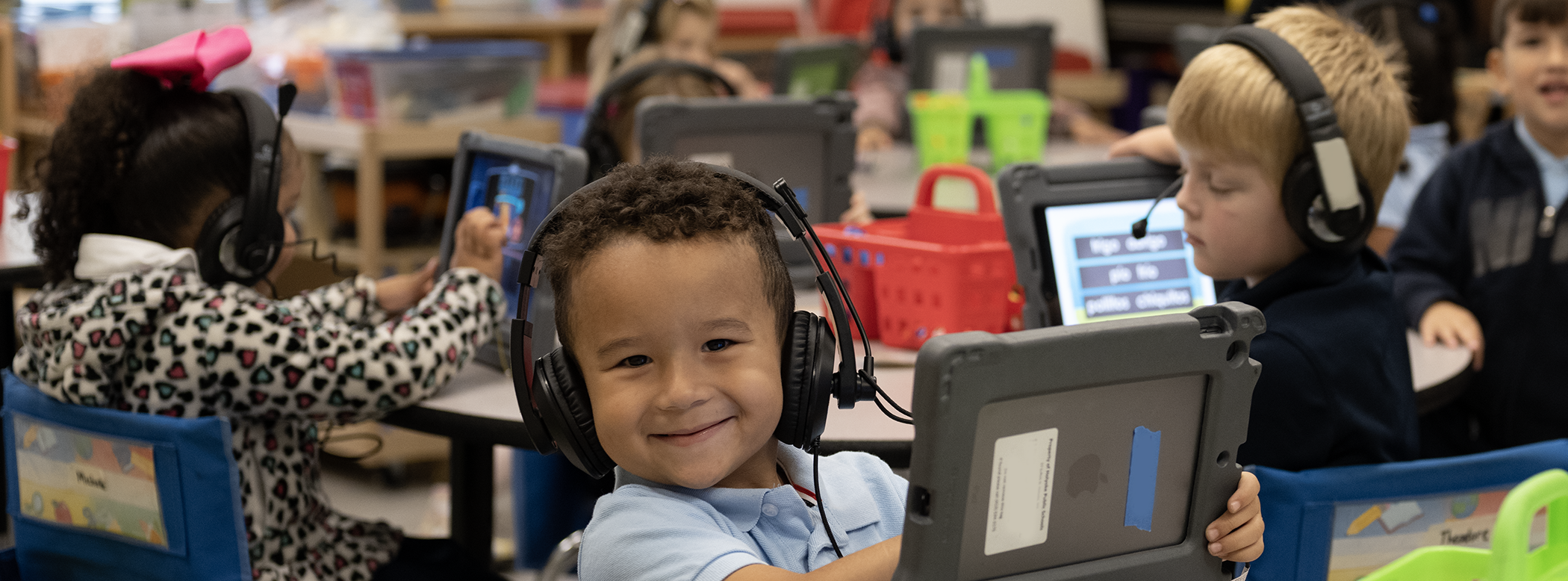 Smiling young boy wearing headset