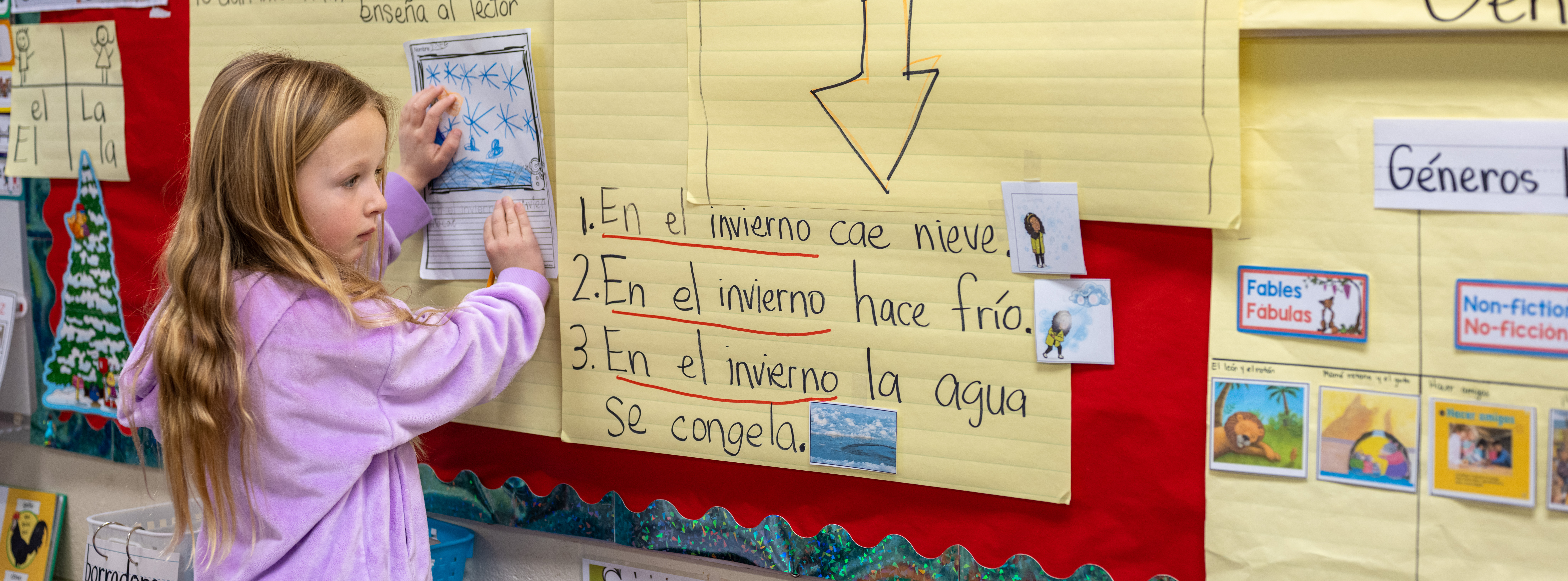 Dual language student at E.N. White school copying from the board. 