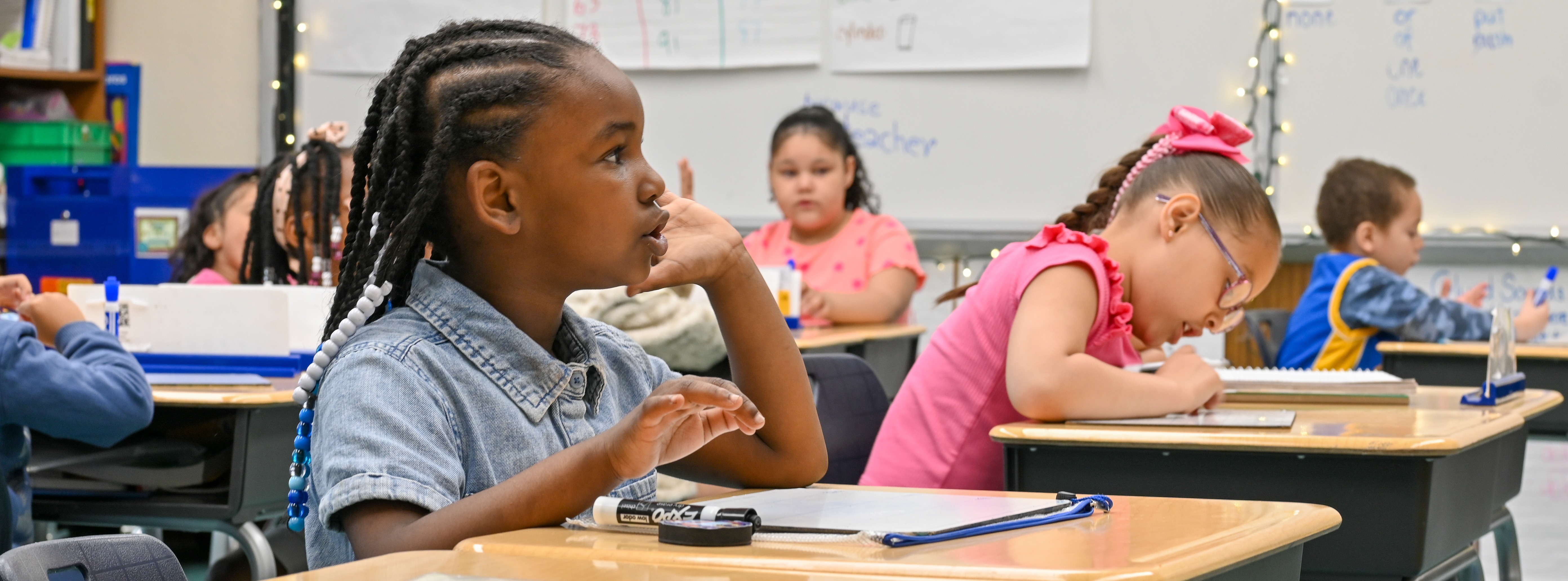 student sitting at desk answering a question