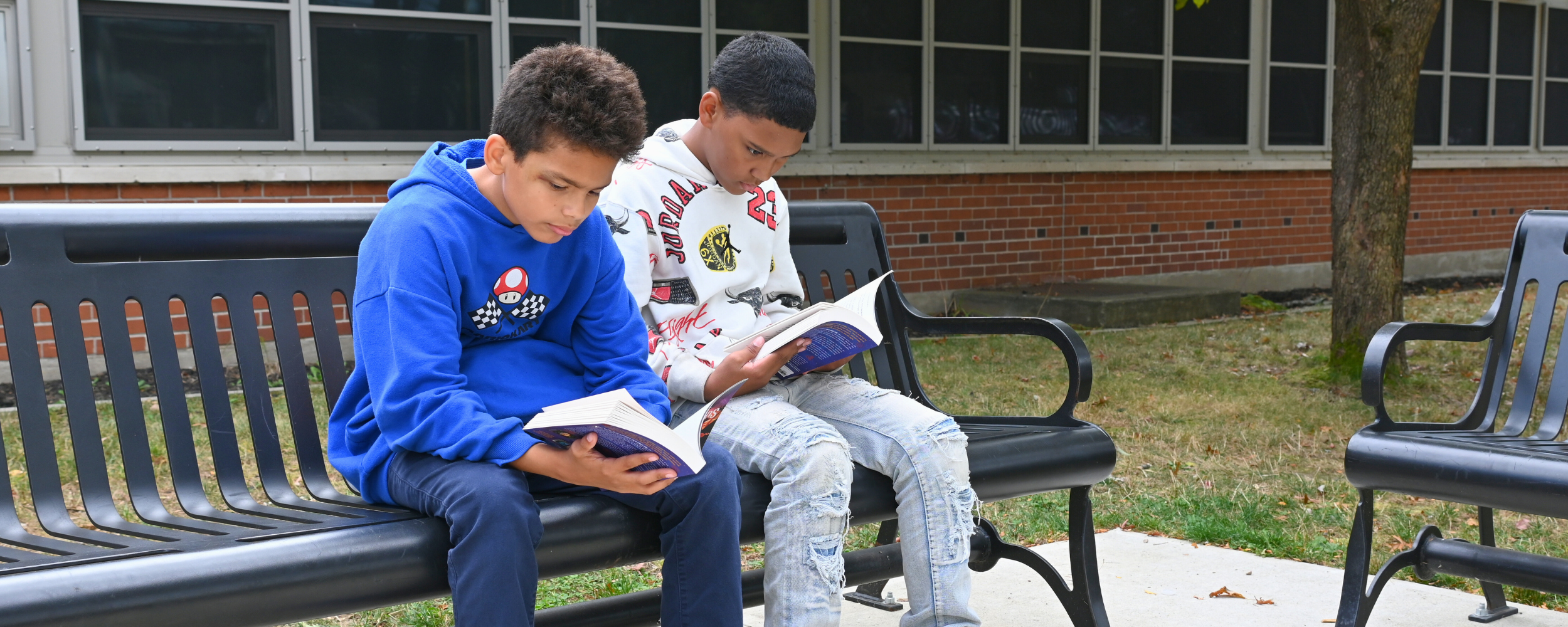 Two students read outside