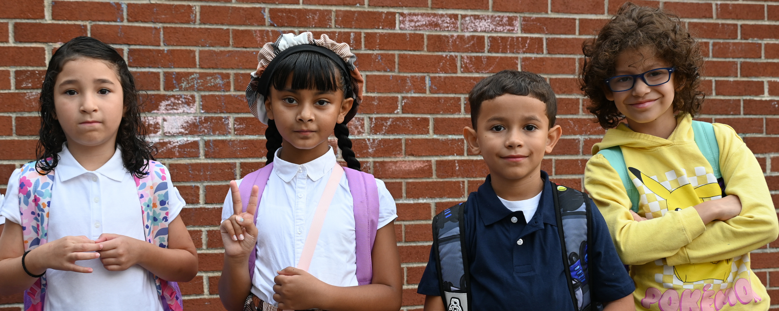 Four students smile on the first day of school