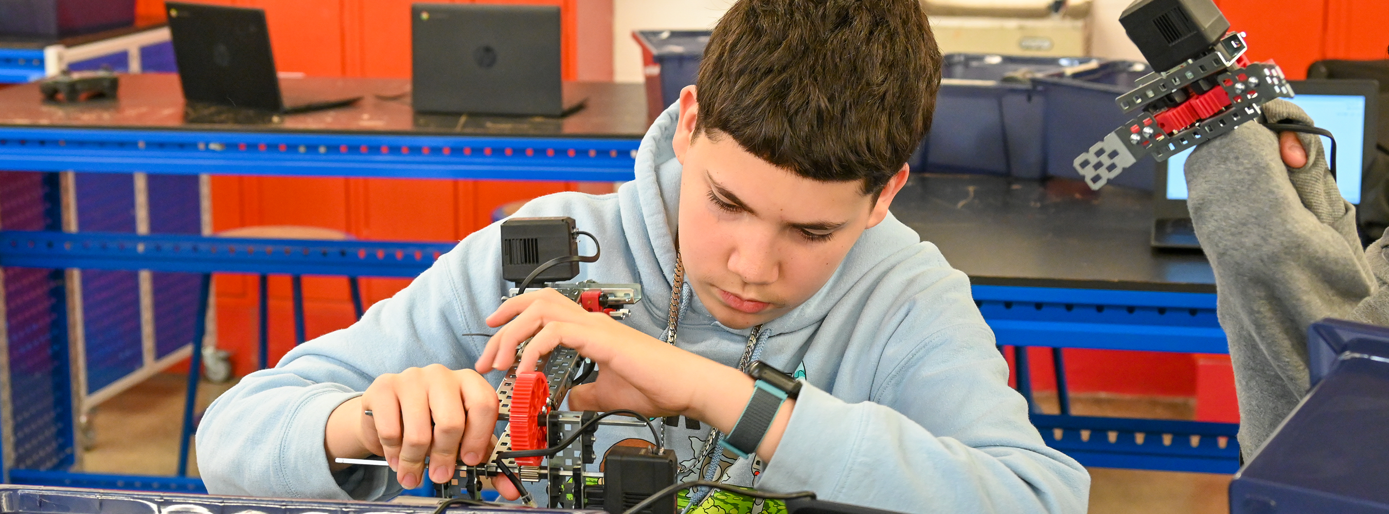 Student works on a robot