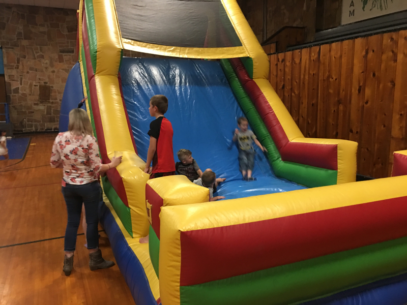 children on blowup slide