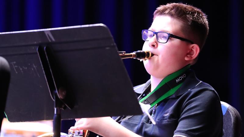 Teen playing saxophone 