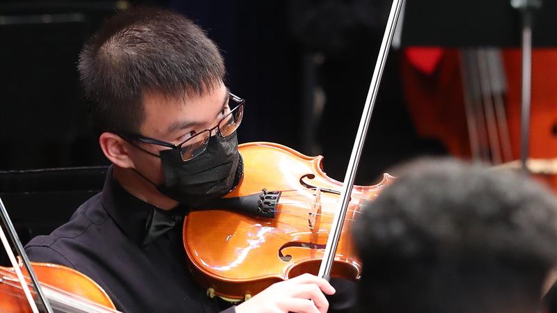 Teen playing violin