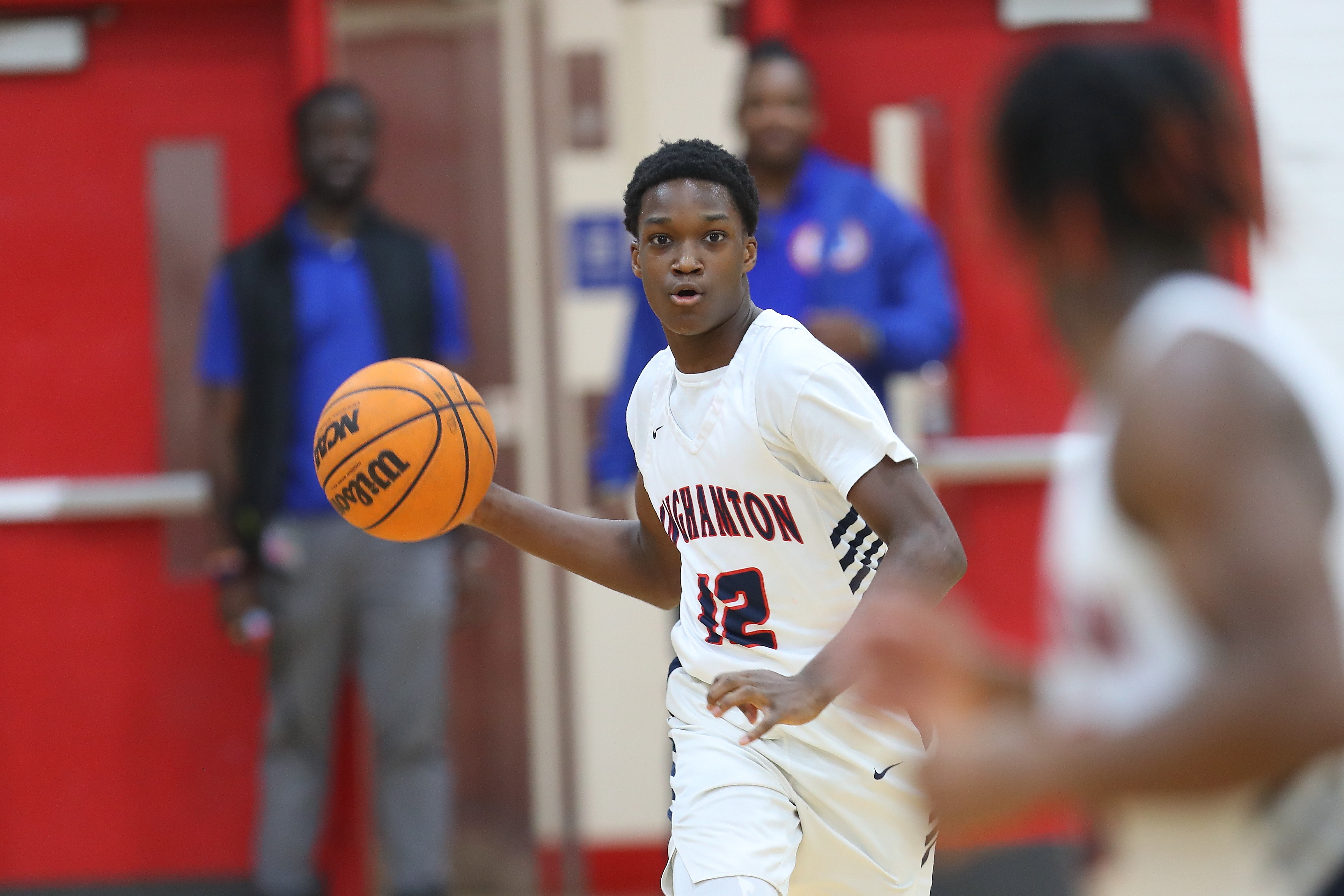 basketball player passes ball