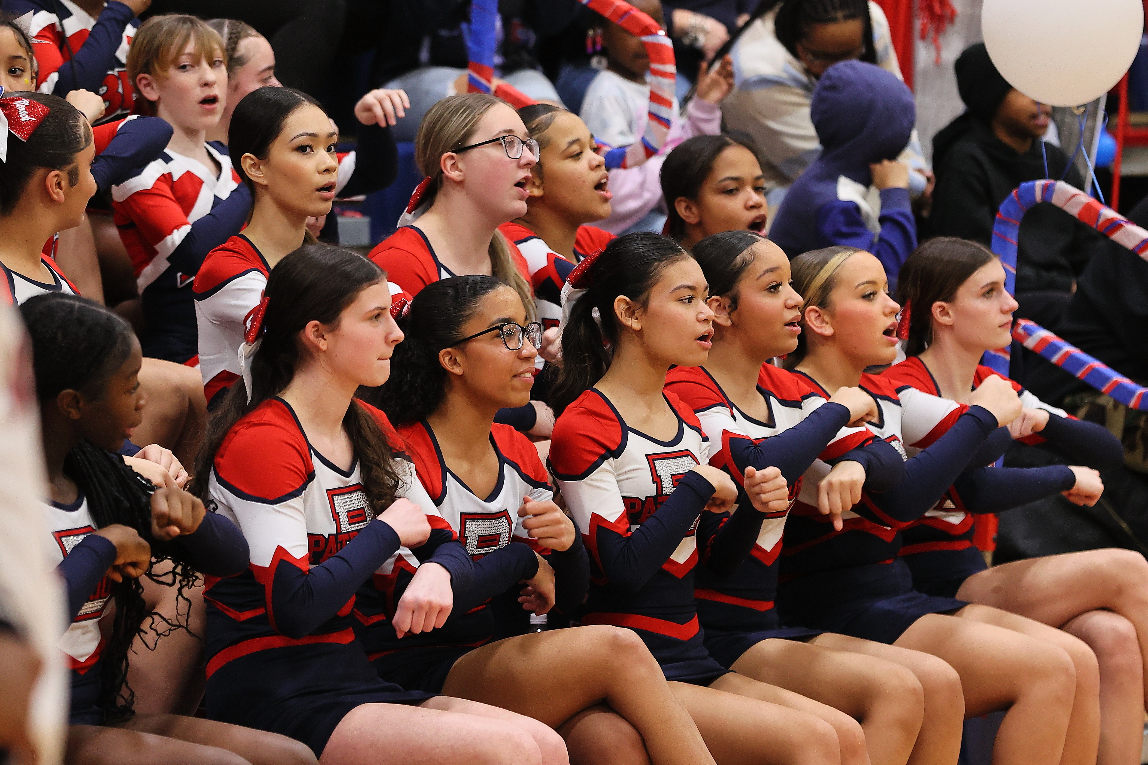 cheerleaders cheering during basketball game