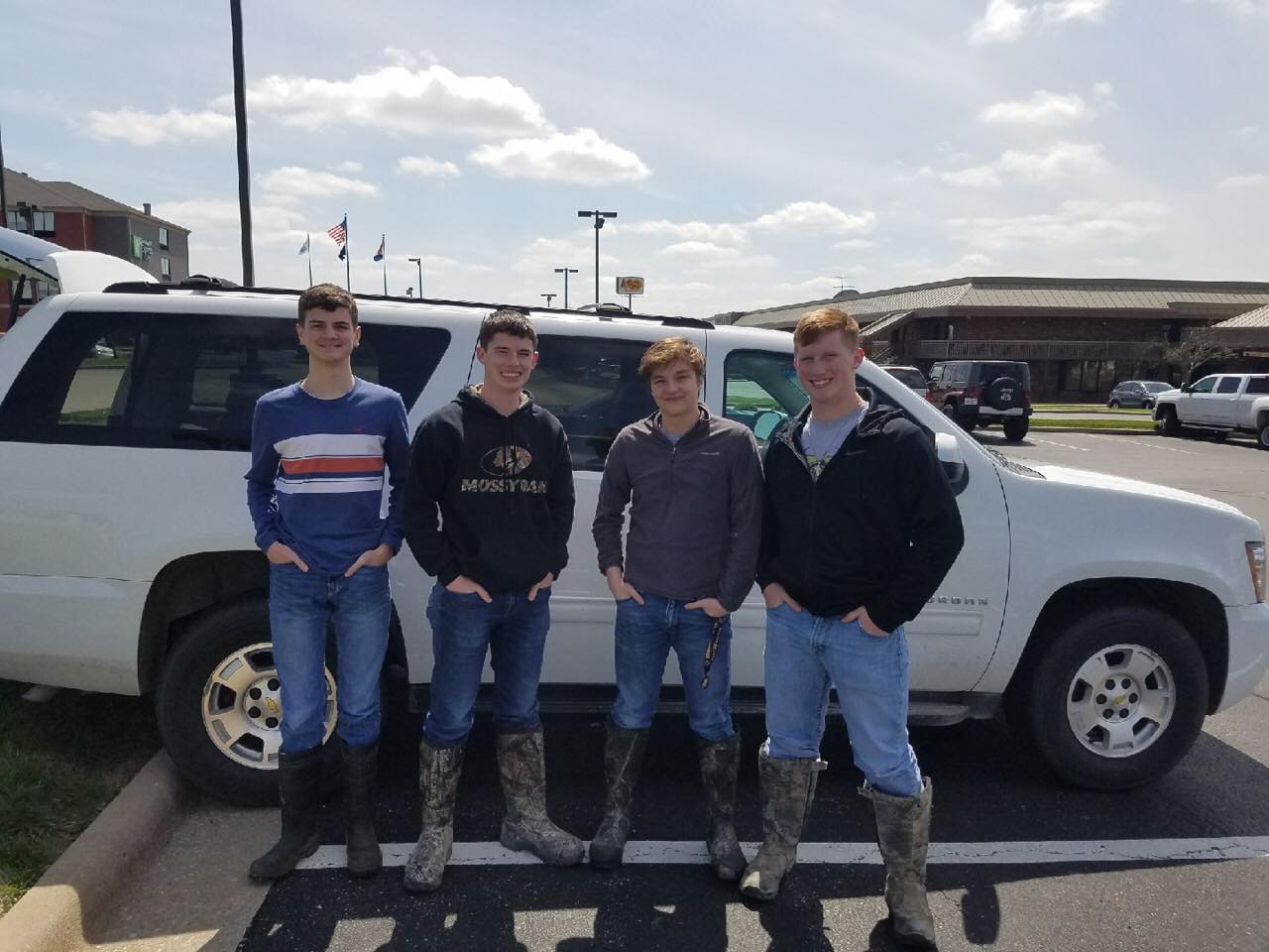 Students in front of a car